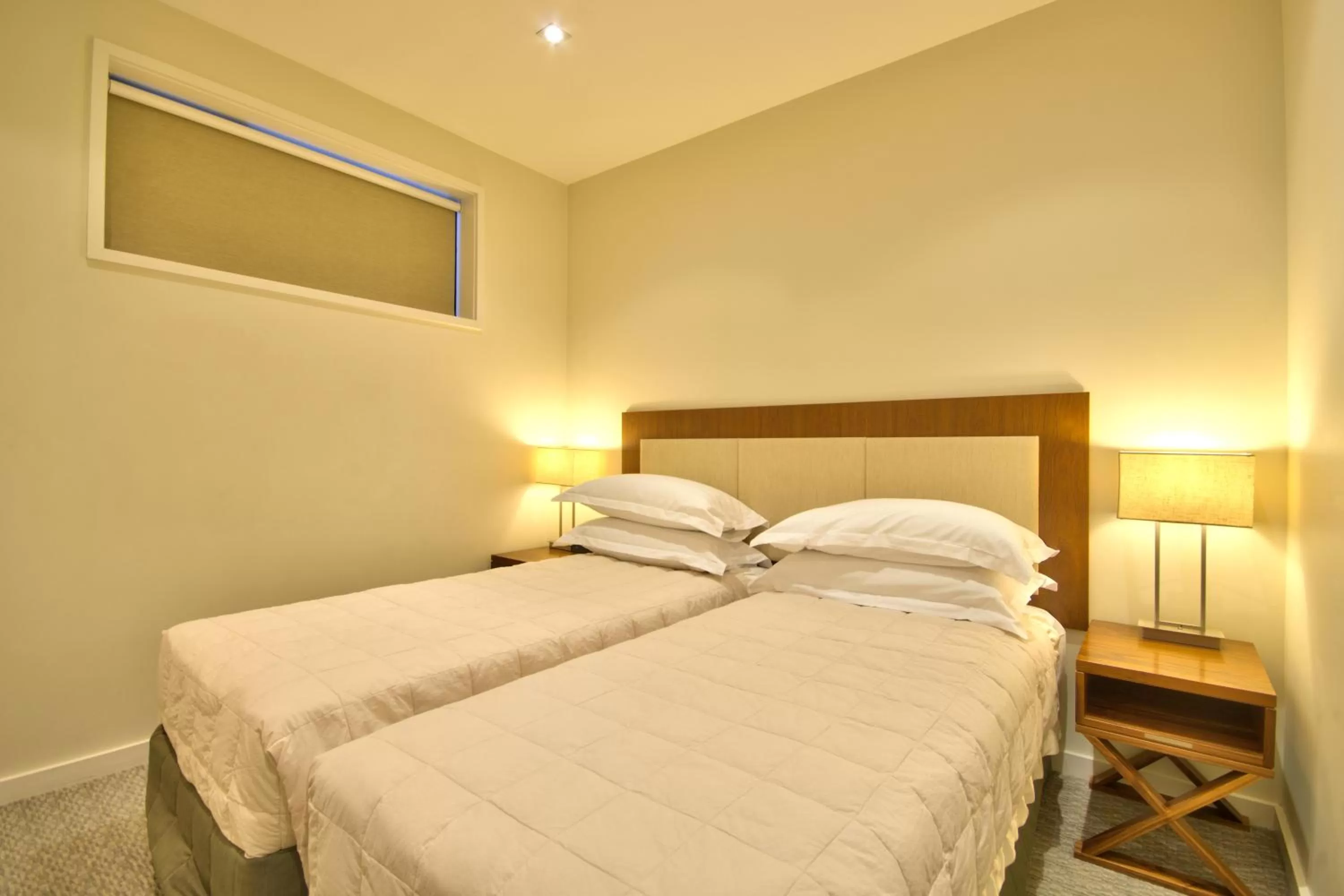 Bed in The Rees Hotel & Luxury Apartments