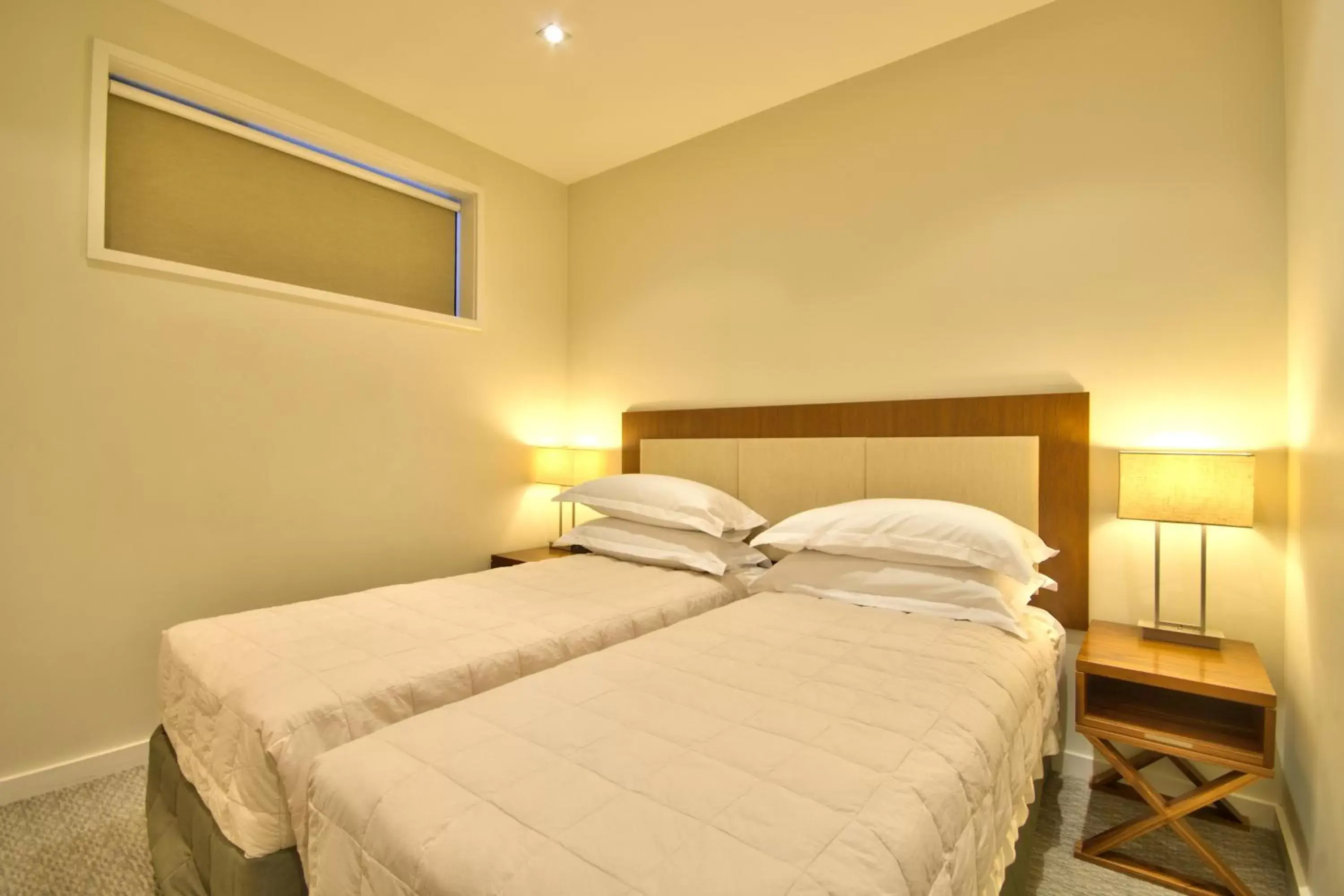 Bed in The Rees Hotel & Luxury Apartments