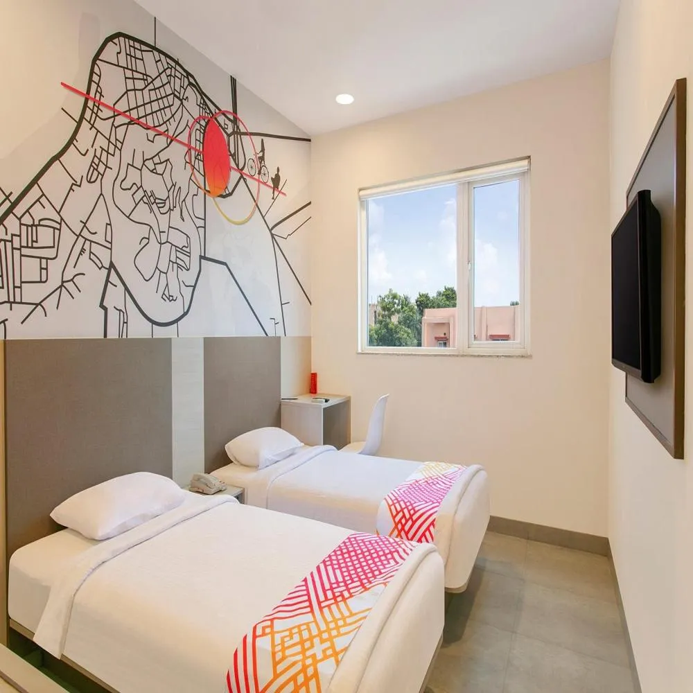 Communal lounge/ TV room, Bed in Ginger Bhubaneshwar