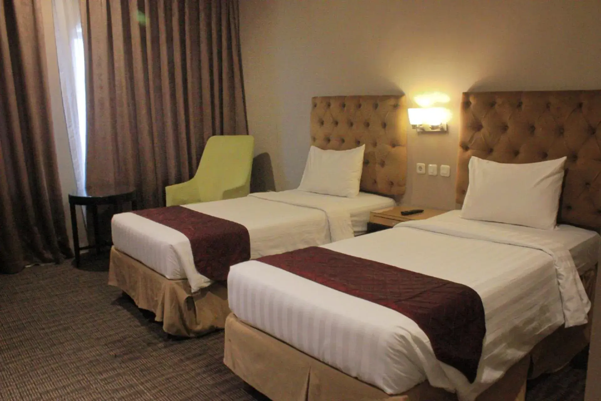 Bed in The Mirah Bogor Hotel