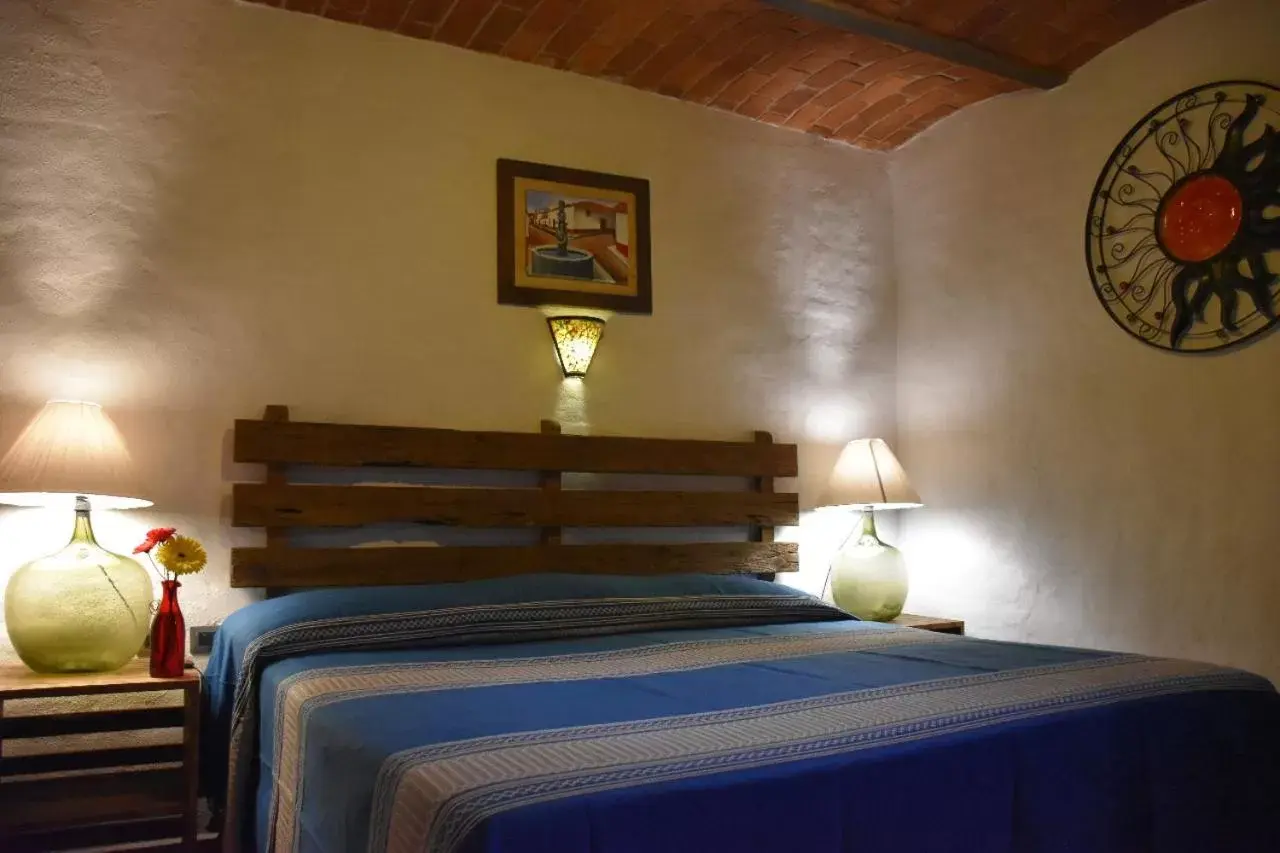 Bed in Hotel Mi Pueblito by Rotamundos