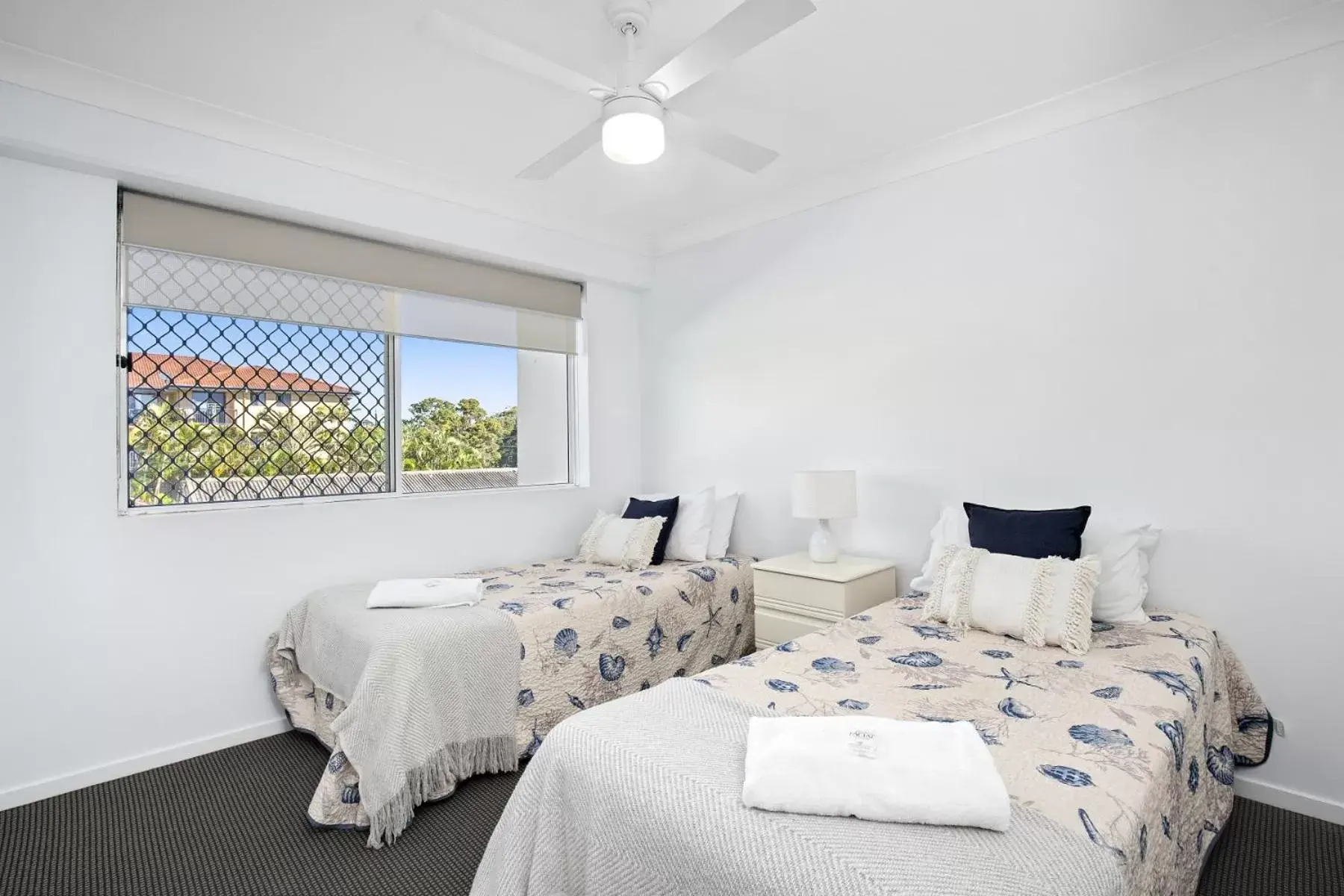 Bed in Kirra Palms Holiday Apartments