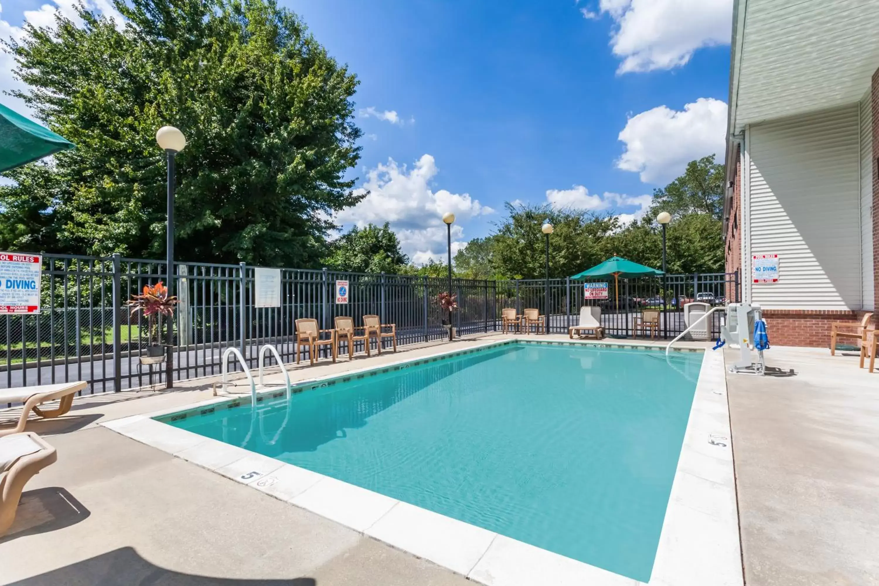 Patio, Swimming Pool in Days Inn & Suites by Wyndham Cambridge