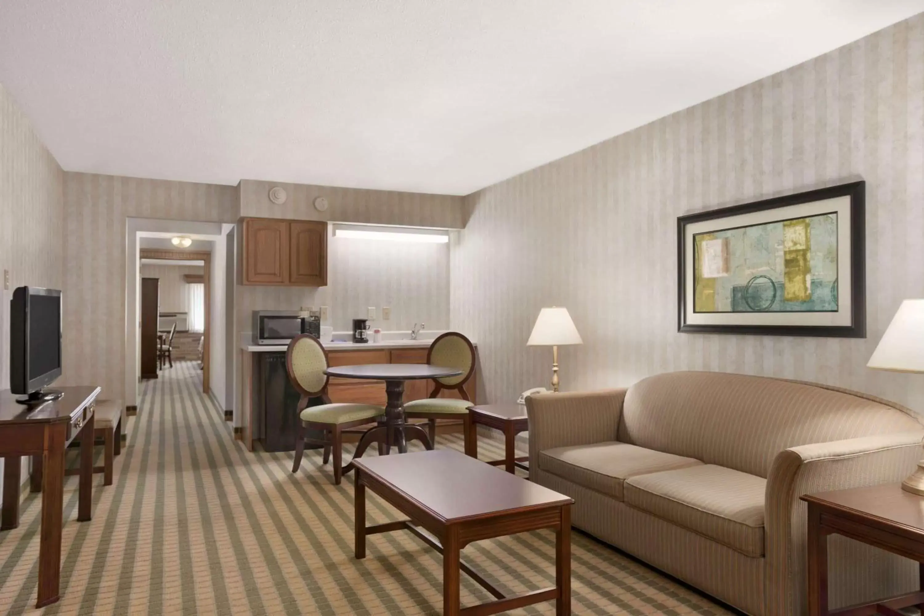 Photo of the whole room, Seating Area in Ramada by Wyndham Saginaw Hotel & Suites