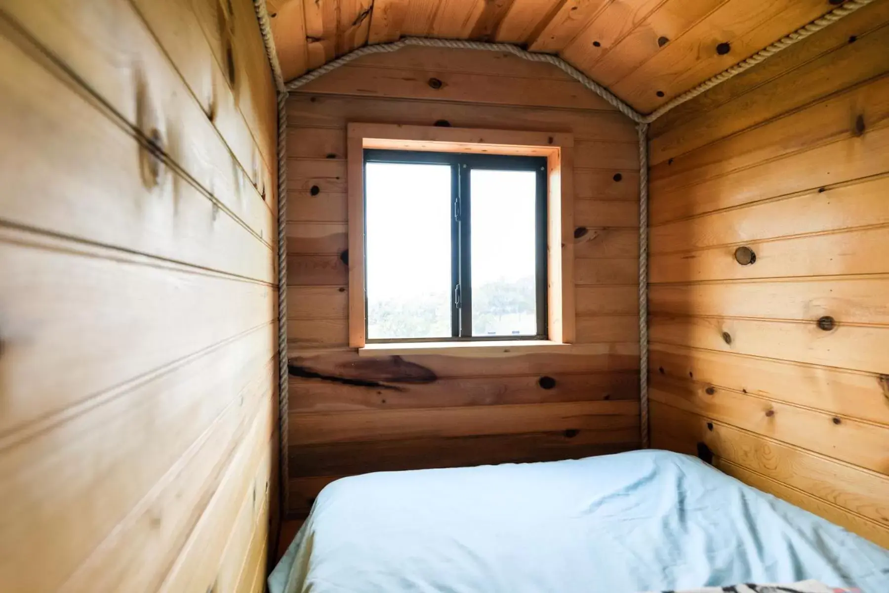 Bed in Walnut Canyon Cabins