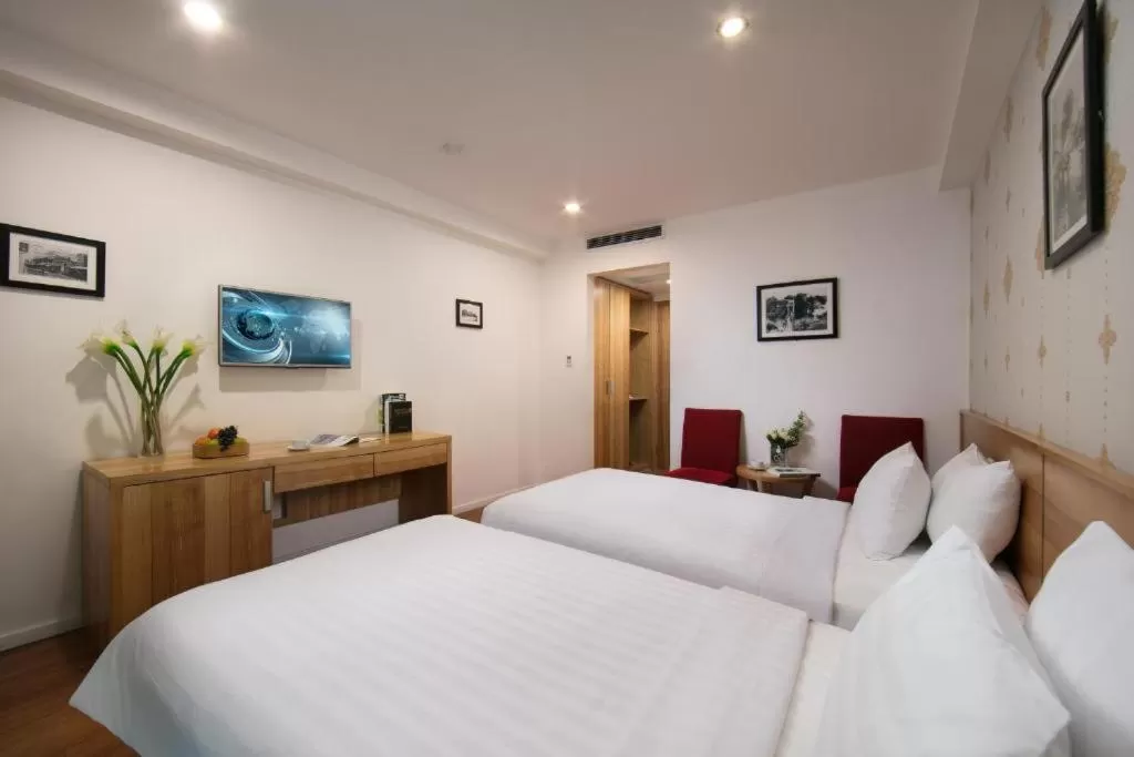 Bed in Aviary Hanoi Hotel & Travel