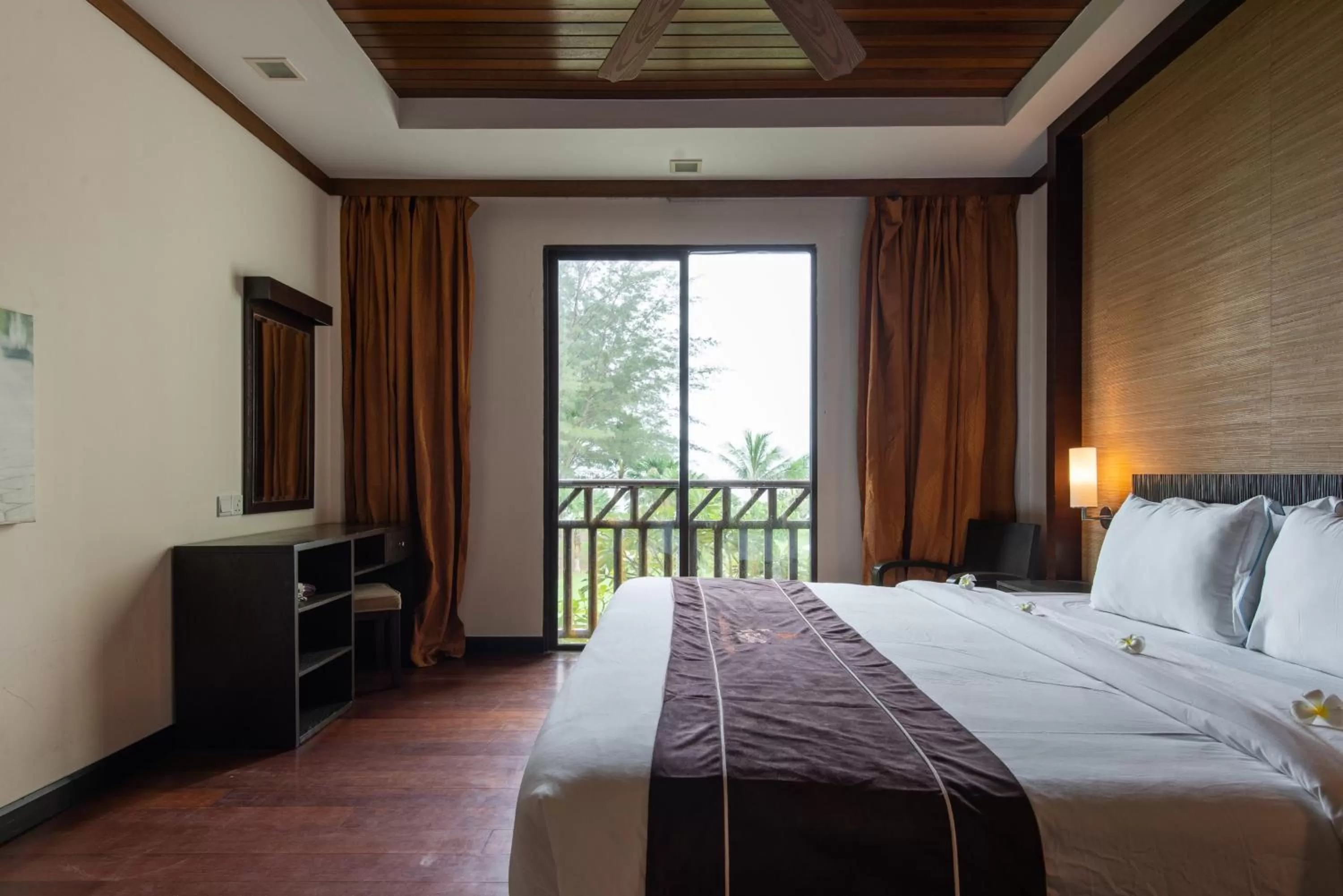 Bed in Sabah Beach Villas & Suites