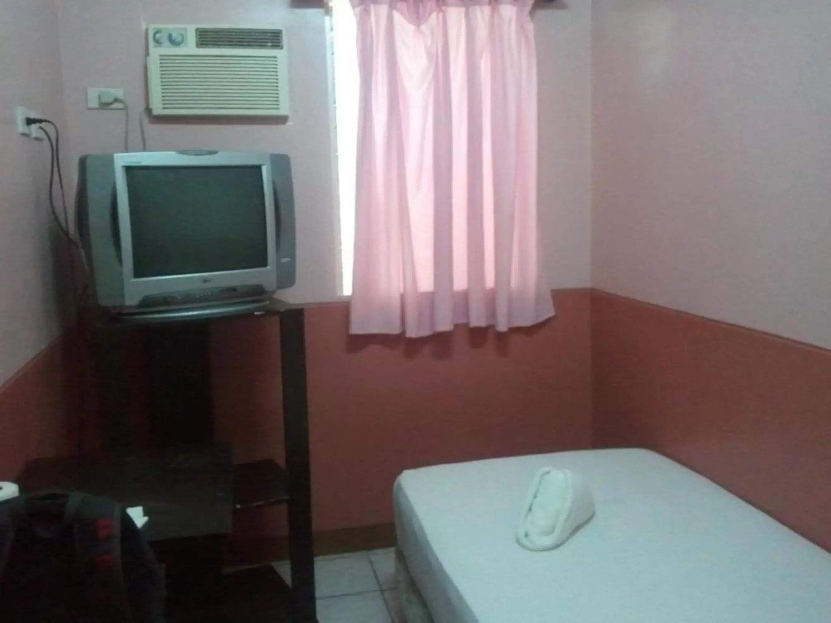 Bed, TV/Entertainment Center in GV Hotel - Camiguin