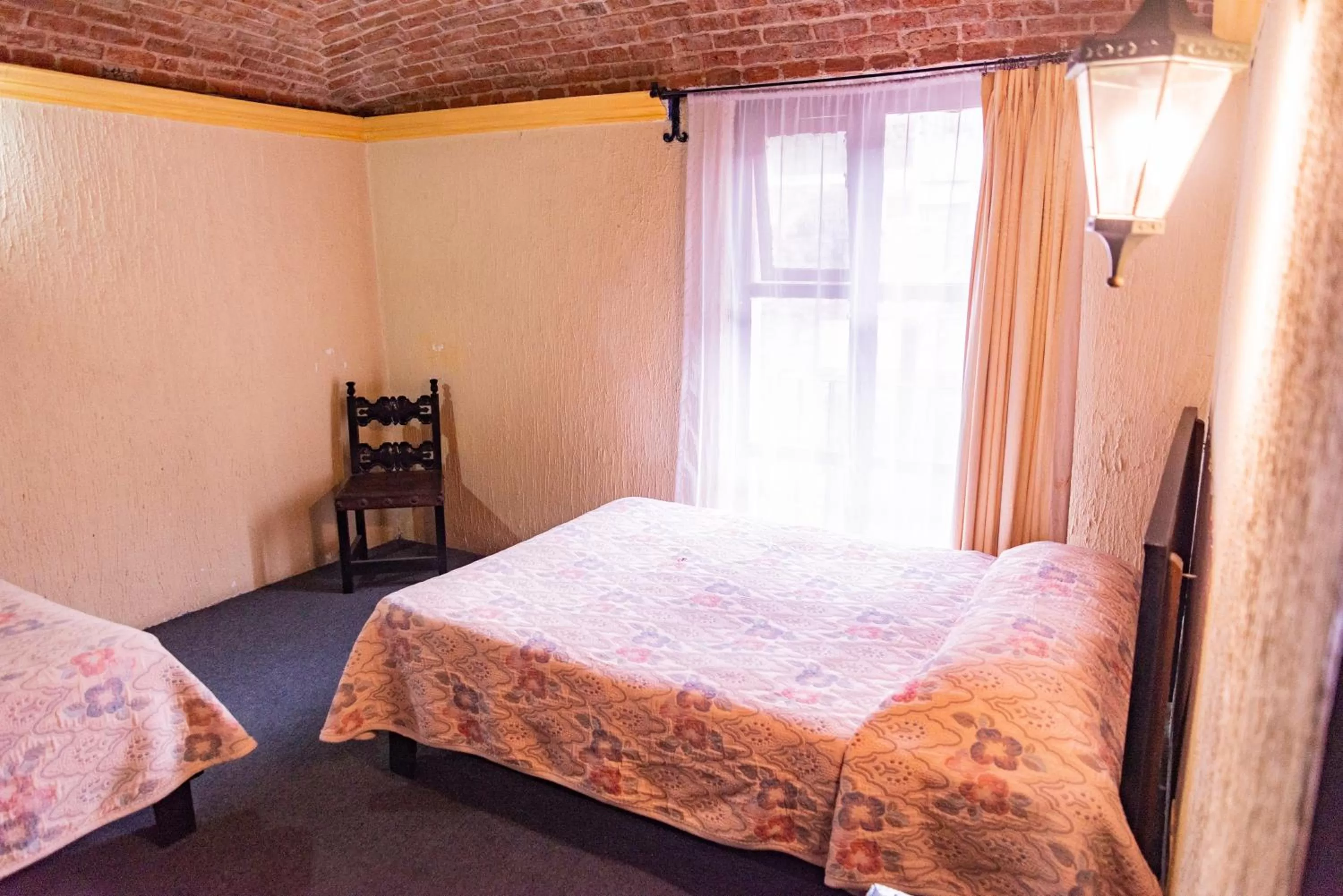 Bed in Hotel Hacienda de Cobos