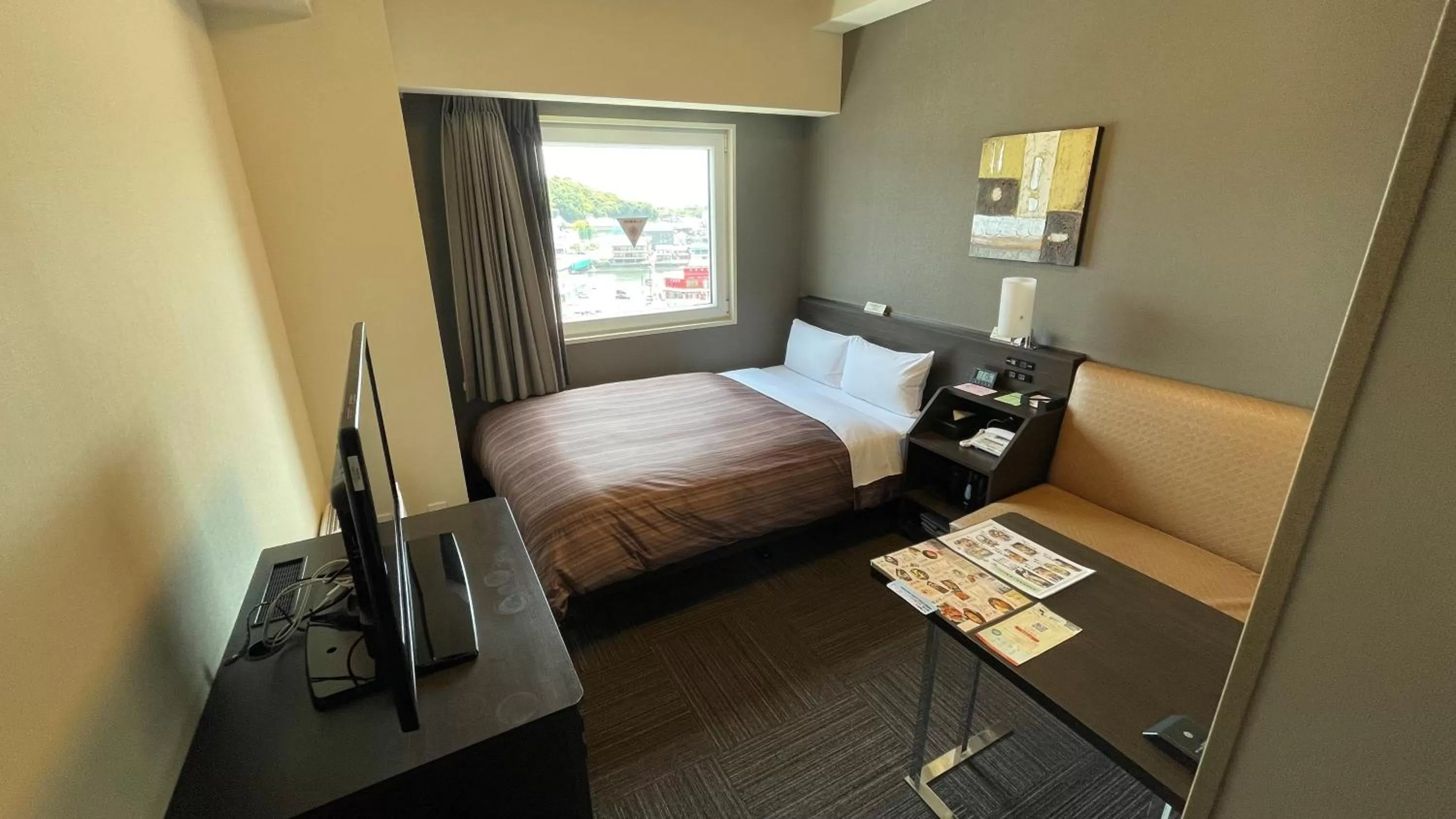 Photo of the whole room, Bed in Hotel Route-Inn Saiki Ekimae