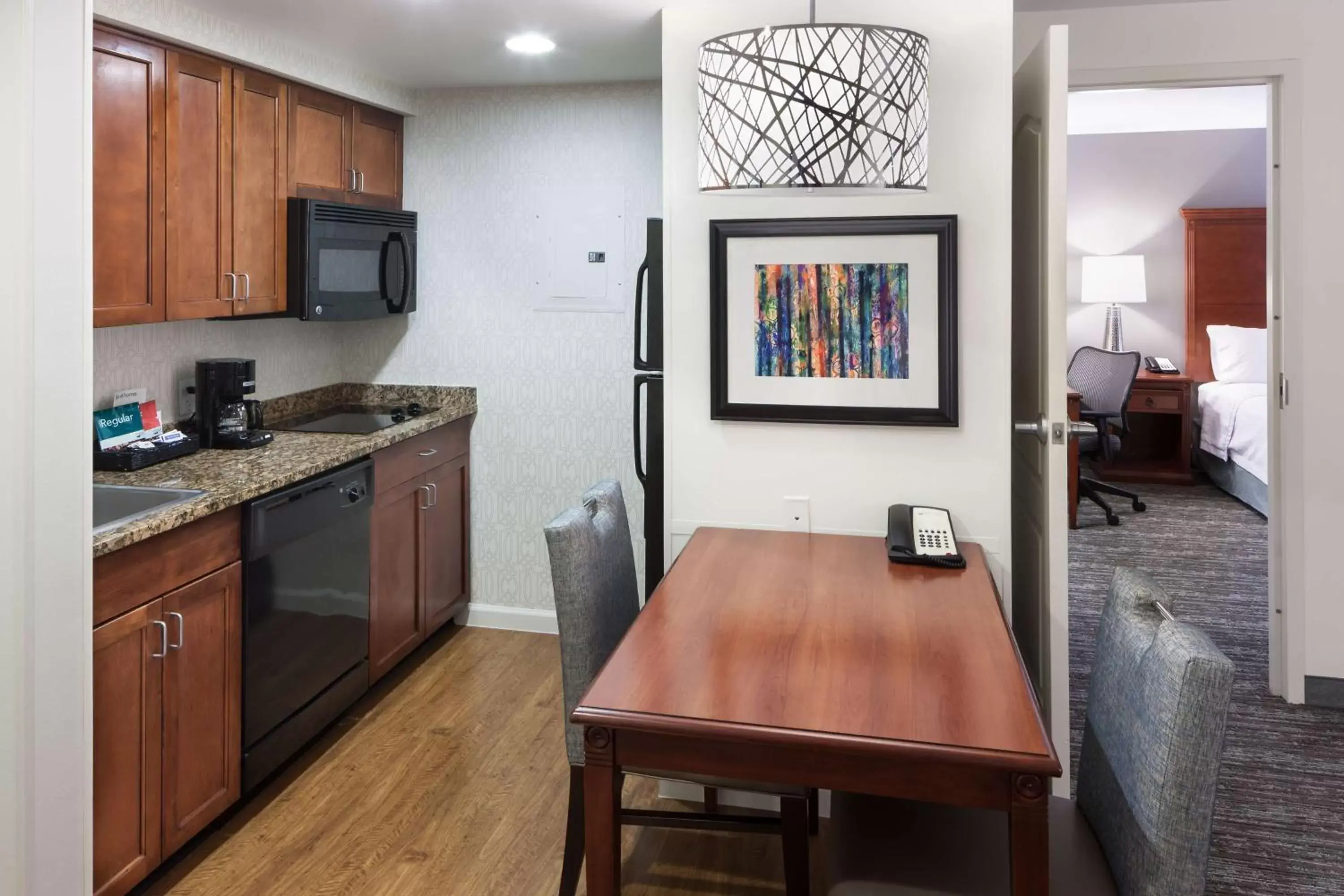 Bedroom, Kitchen/Kitchenette in Homewood Suites Denton