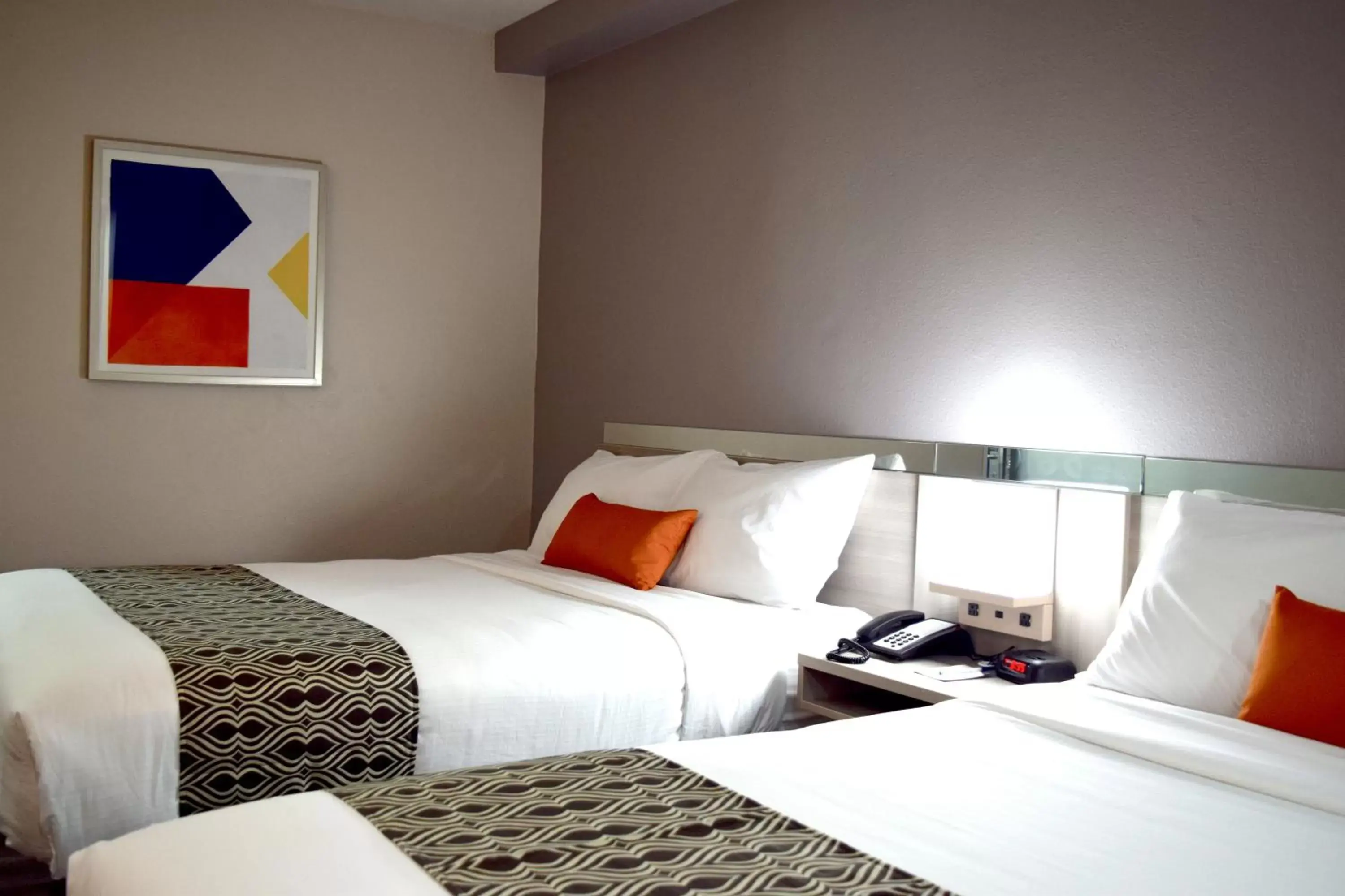 Bed in Microtel Inn & Suites by Wyndham Raleigh