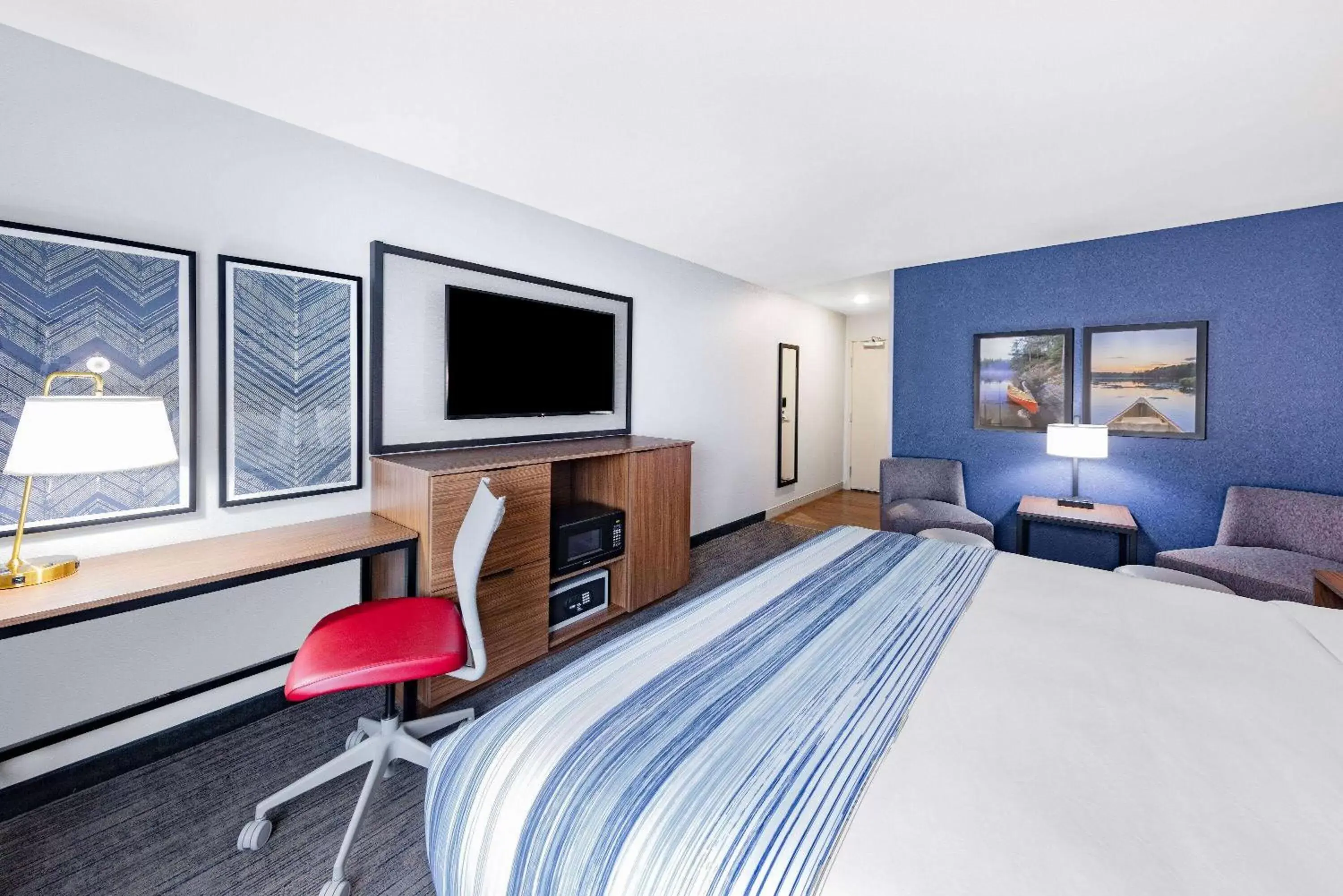 Photo of the whole room, TV/Entertainment Center in AmericInn by Wyndham International Falls