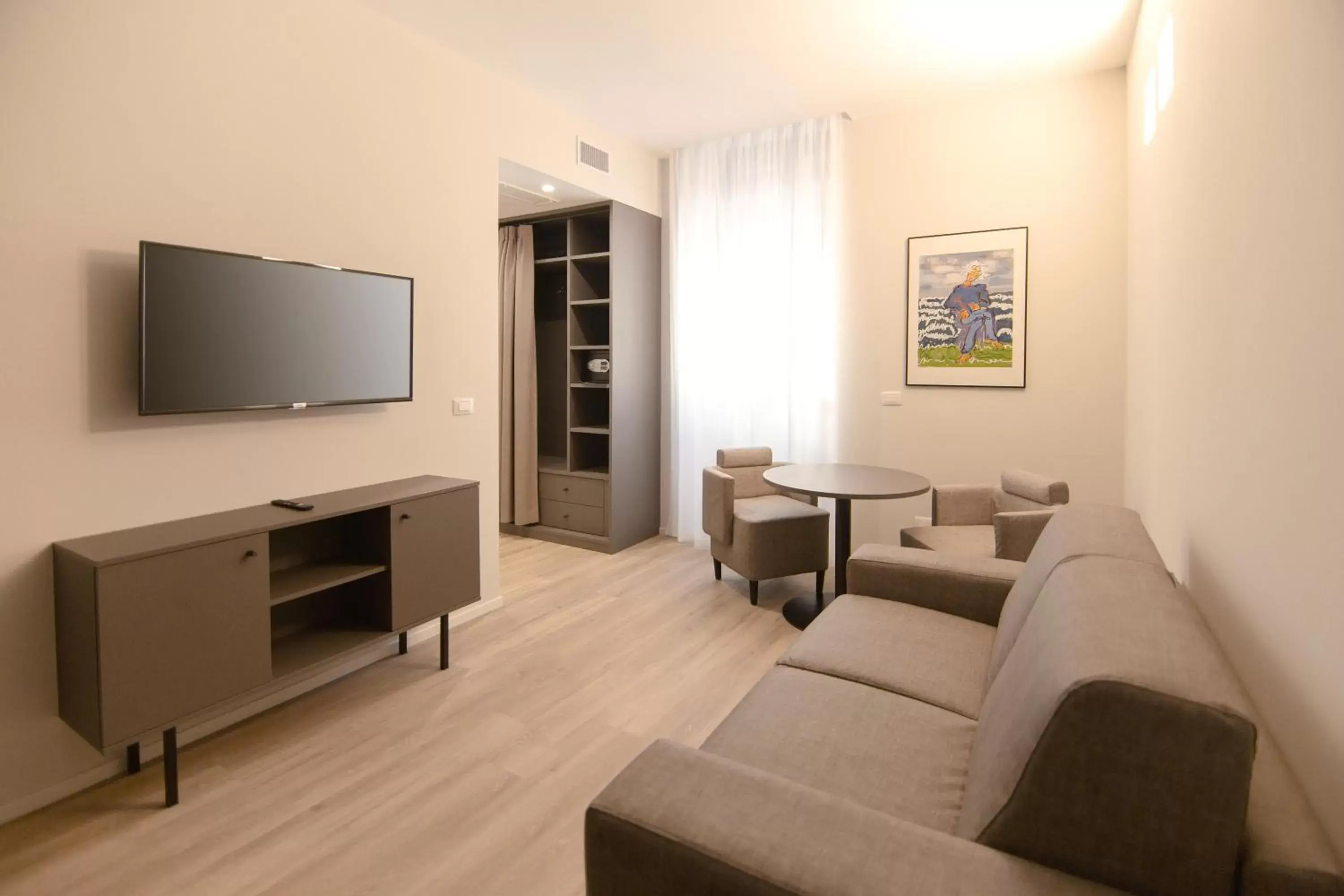 TV and multimedia, Seating Area in Palazzo Bellocchi - Suites & Apartments