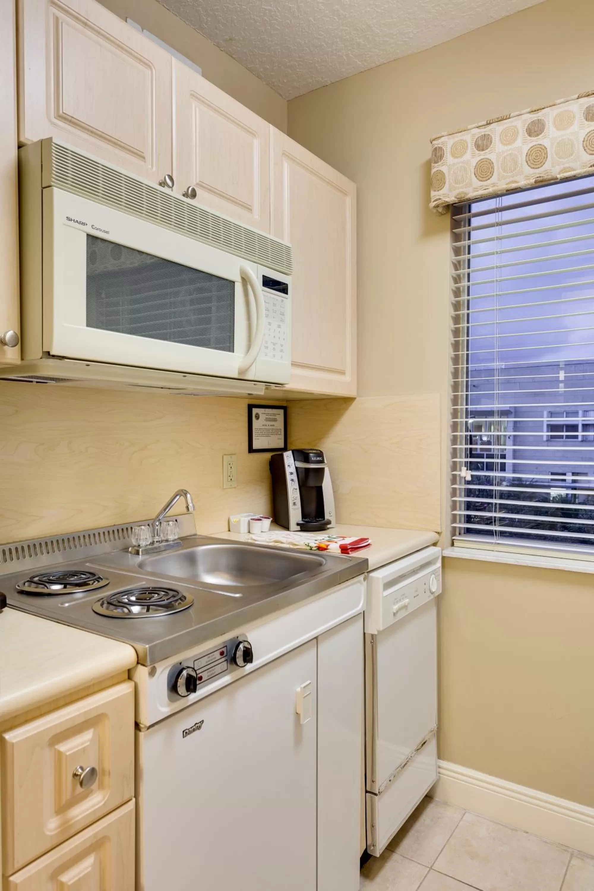 Kitchen or kitchenette in Sun Harbour Boutique Hotel