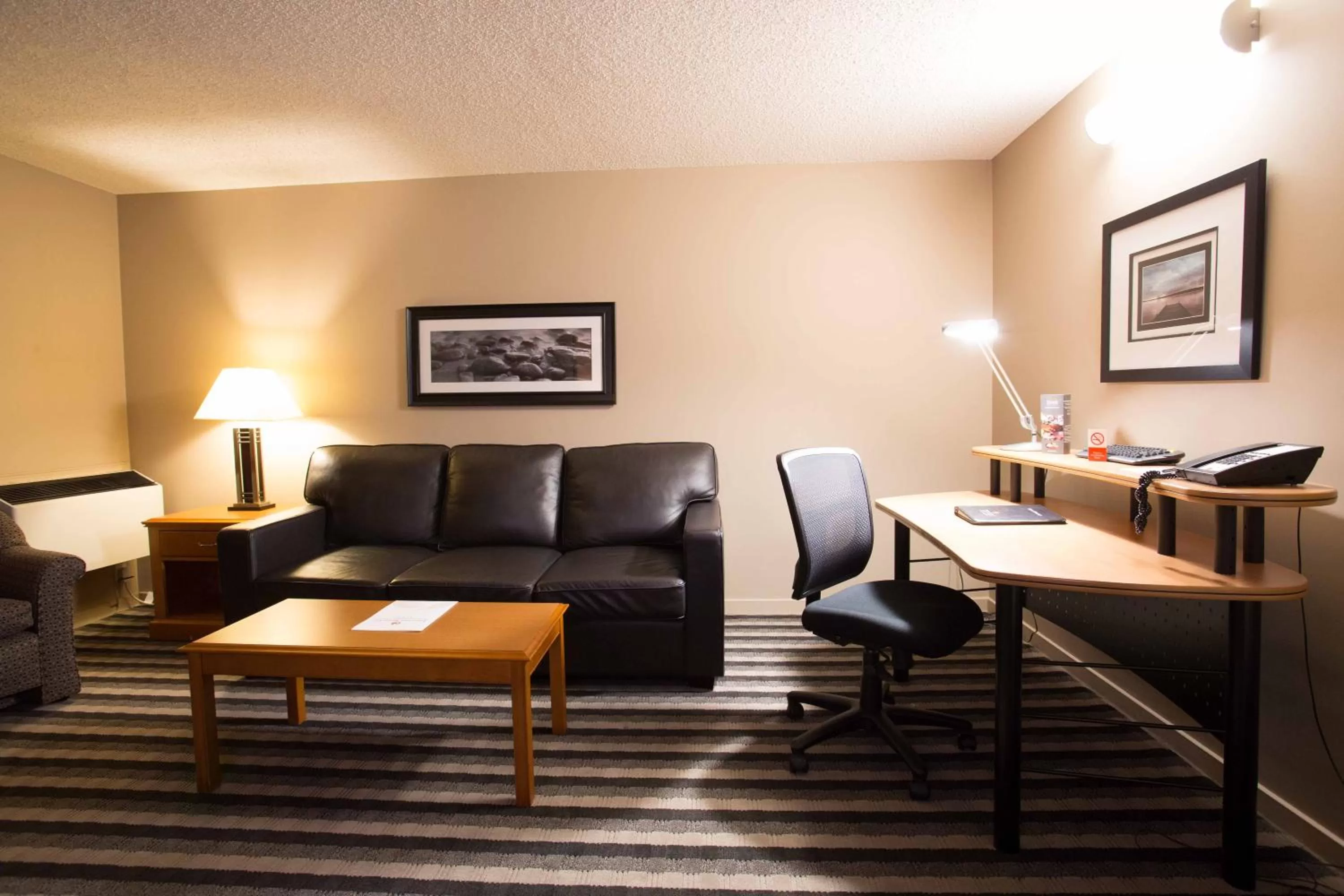 Living room in Royal Hotel West Edmonton, Trademark Collection by Wyndham