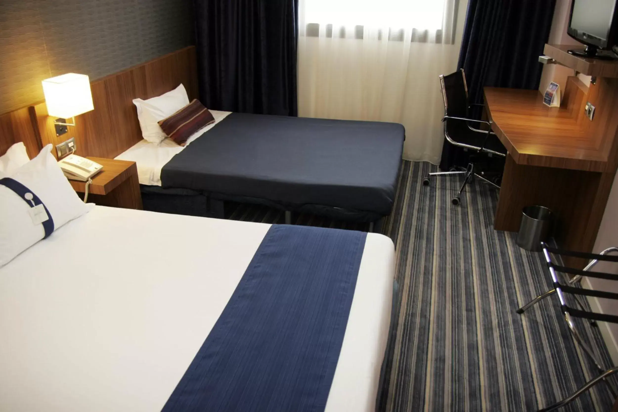Bed in Holiday Inn Express Bilbao Airport, an IHG Hotel