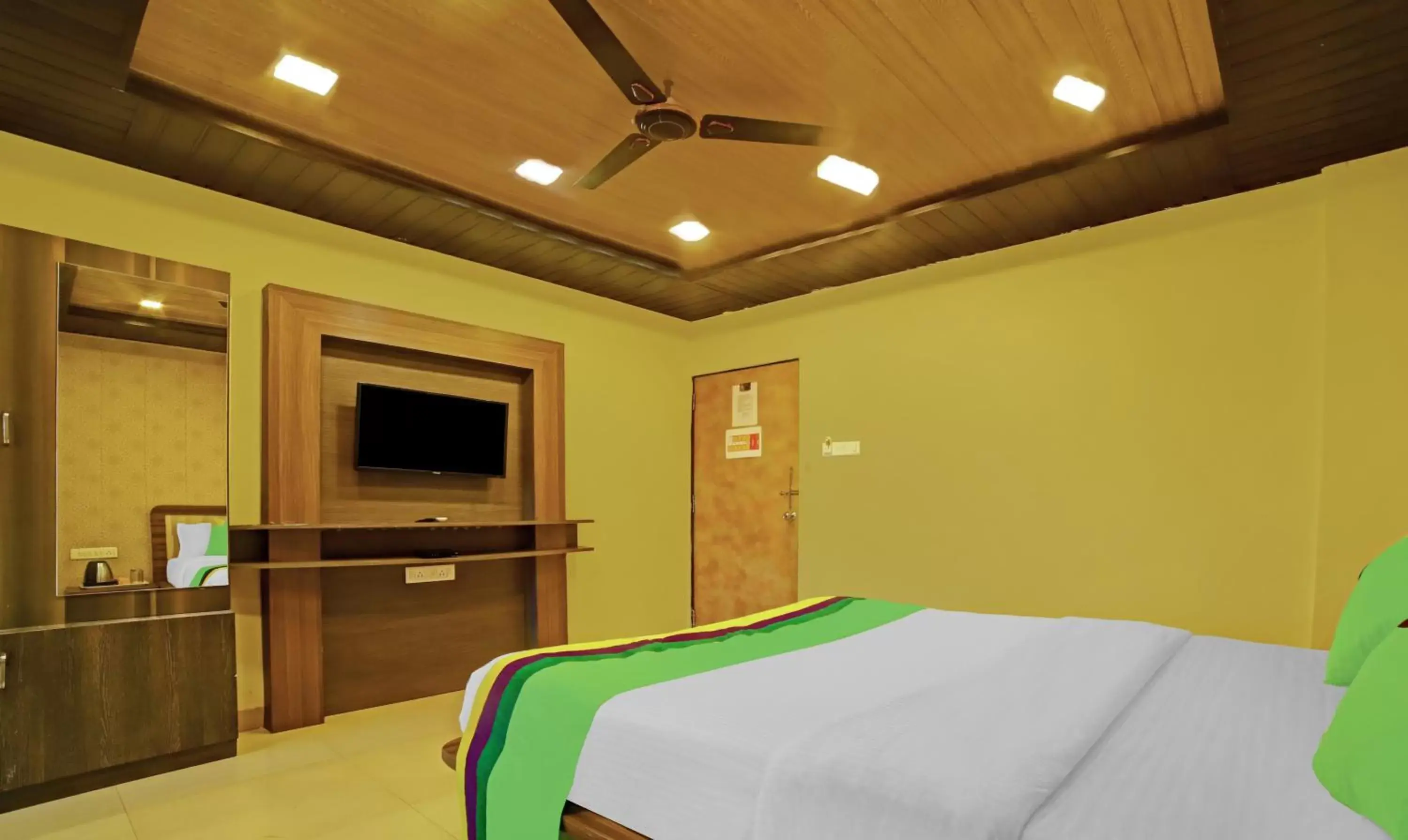Bedroom, Bed in Treebo Balaji Excellency with Pool & Spa Bedroom, Bed in Treebo Balaji Excellency with Pool & Spa