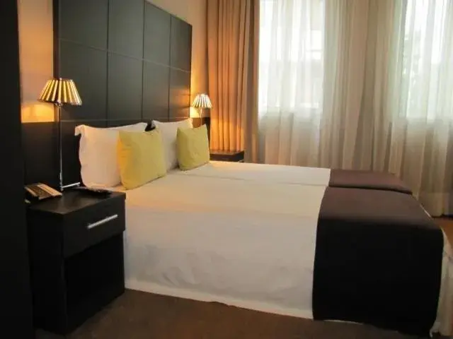 Bed in TANA Hotel