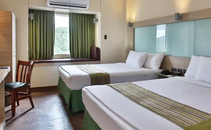 Bed in Microtel by Wyndham Baguio