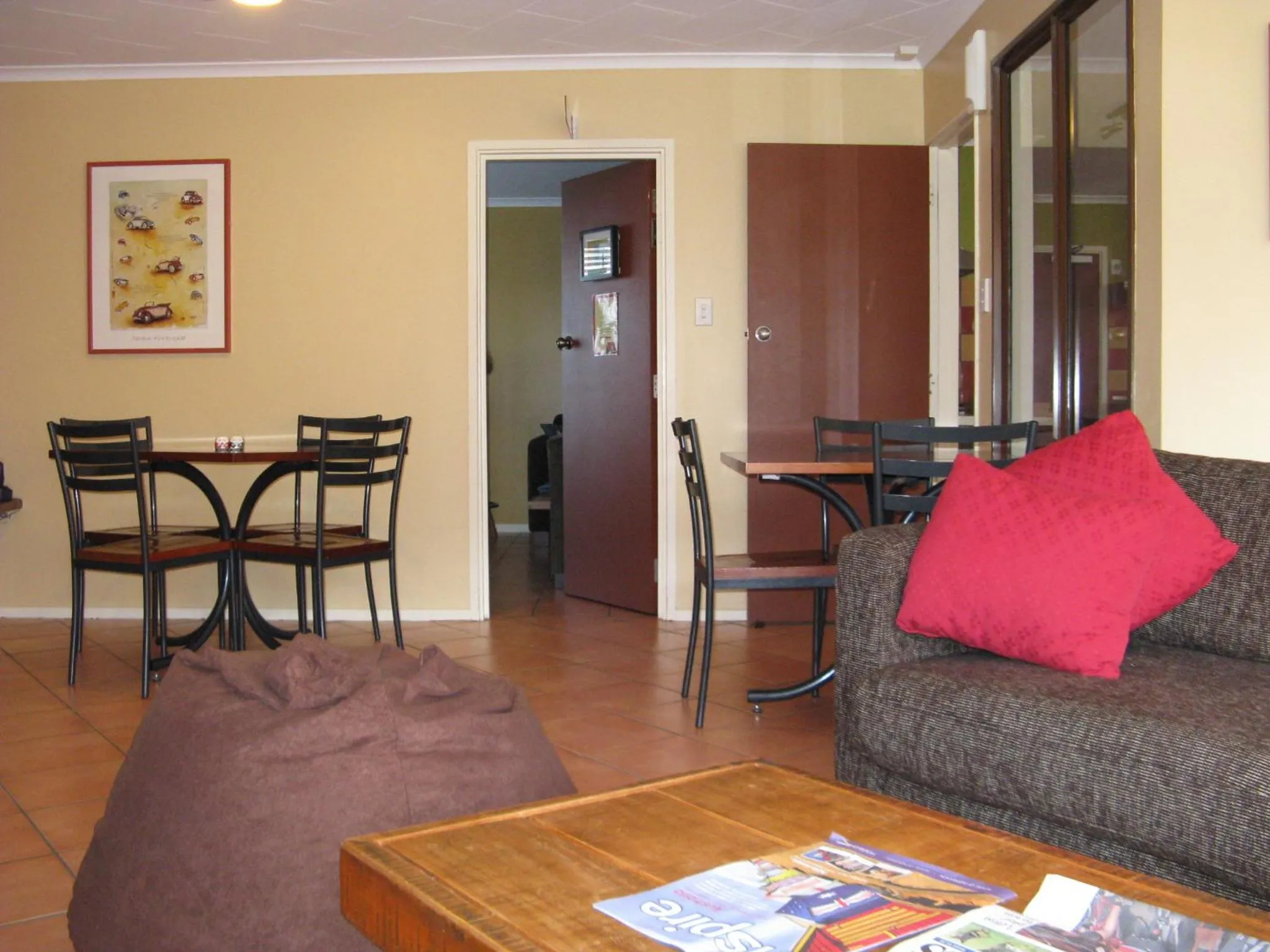 Communal lounge/ TV room in The Bug Backpackers