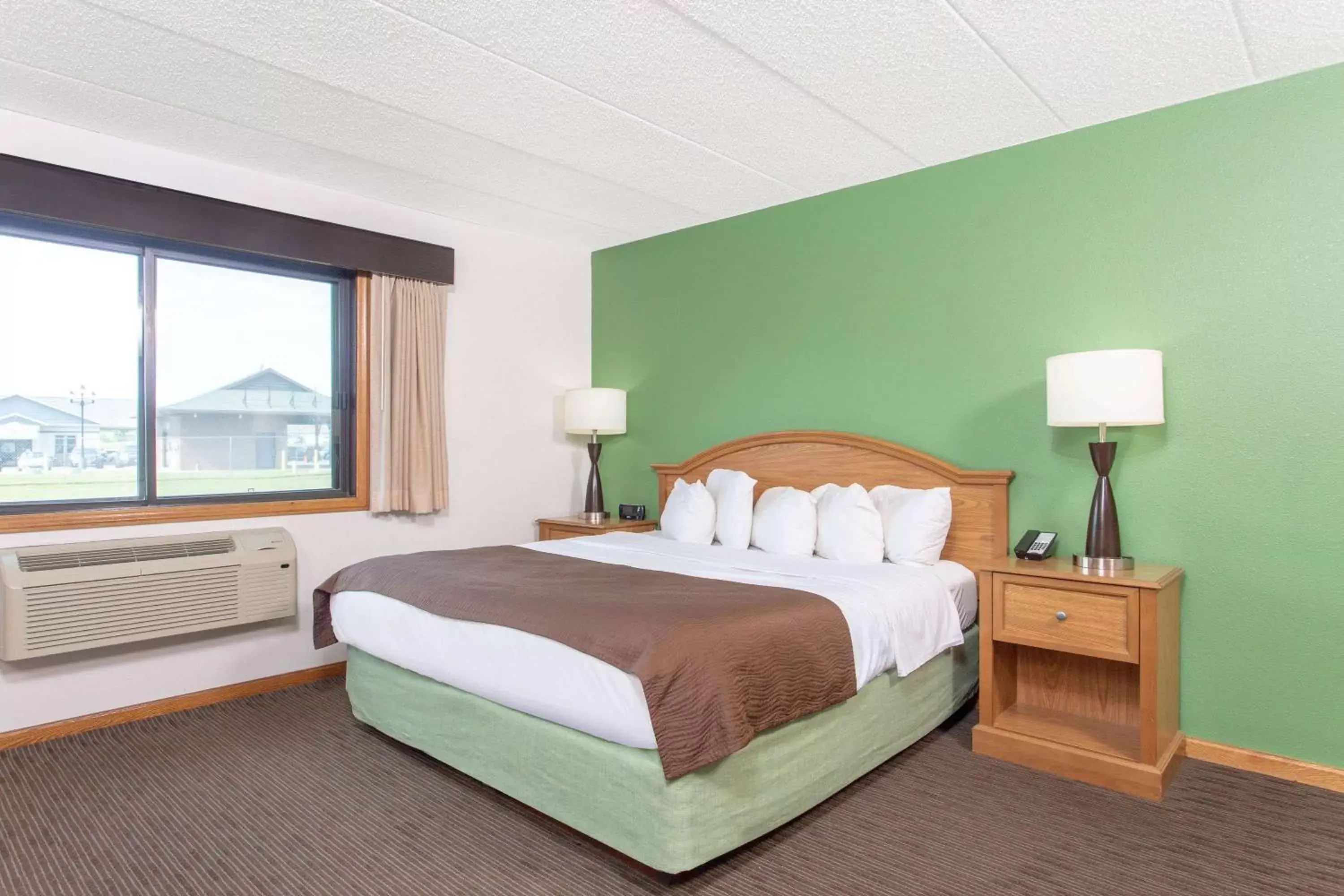 Photo of the whole room, Bed in AmericInn by Wyndham Eau Claire