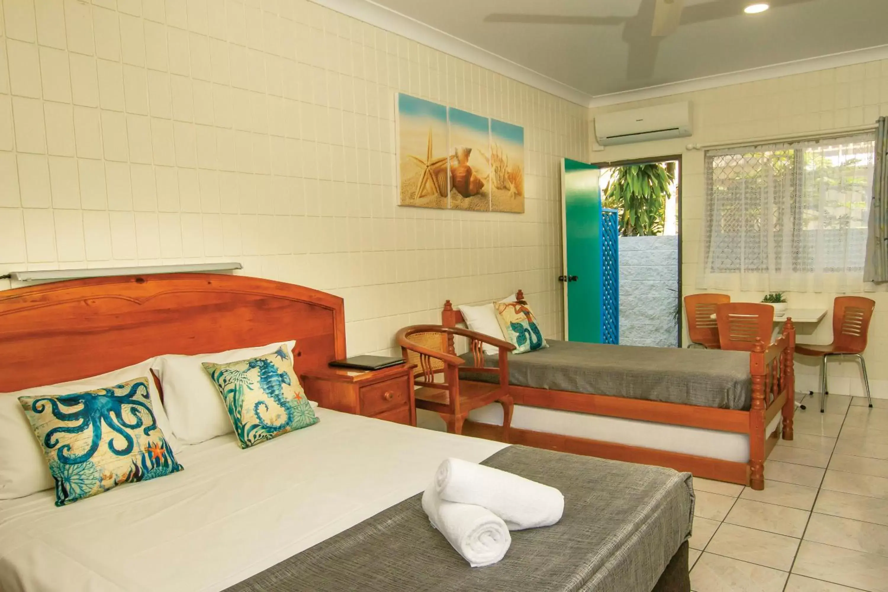 Bed in Tropical Palms Resort & 4WD Hire