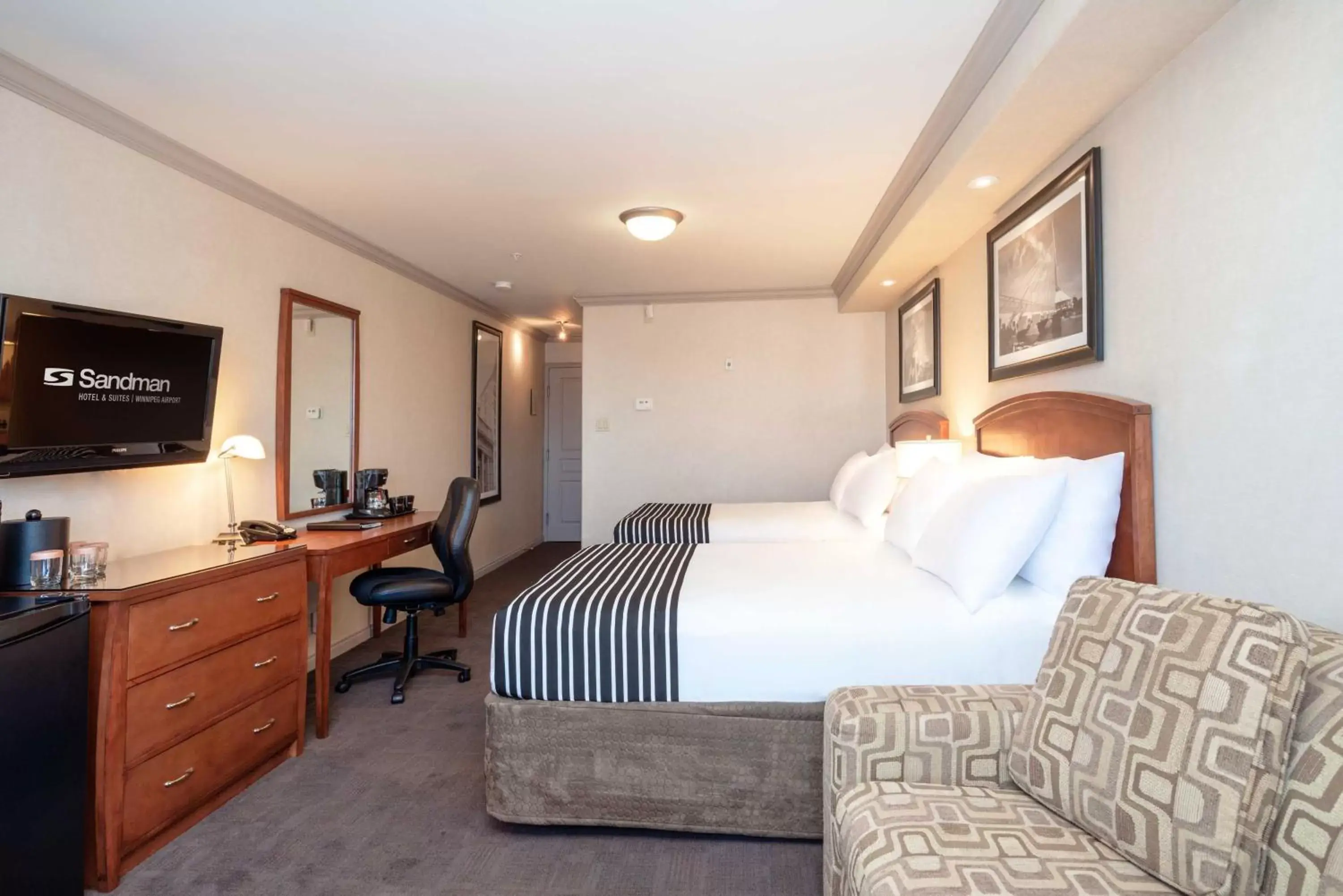 Photo of the whole room, Bed in Sandman Hotel & Suites Winnipeg Airport