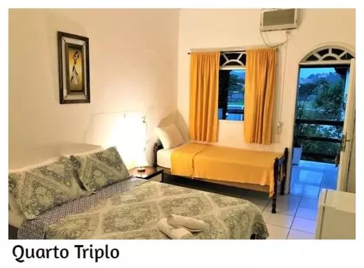 Photo of the whole room, Bed in Pousada Porto Búzios