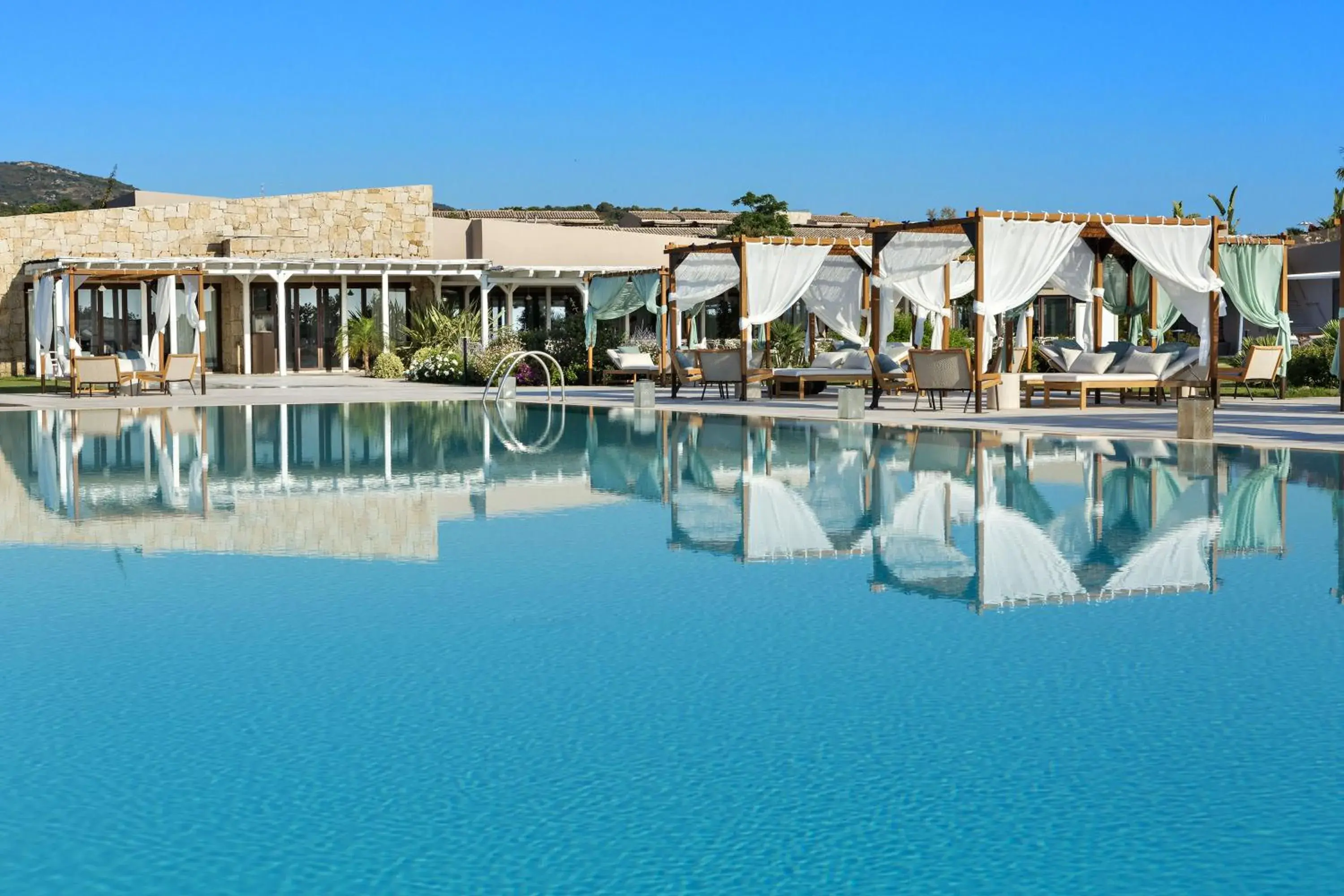 Swimming pool in Baglioni Resort Sardinia - The Leading Hotels of the World Swimming pool in Baglioni Resort Sardinia - The Leading Hotels of the World