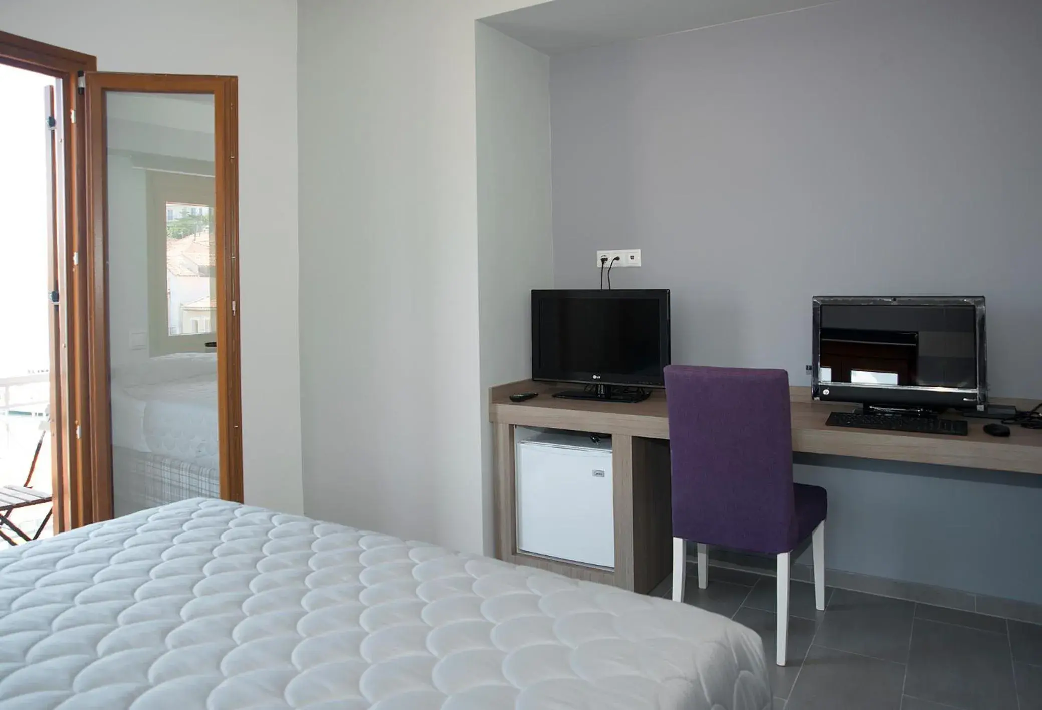 Bedroom, TV/Entertainment Center in Dimitra Boutique Hotel