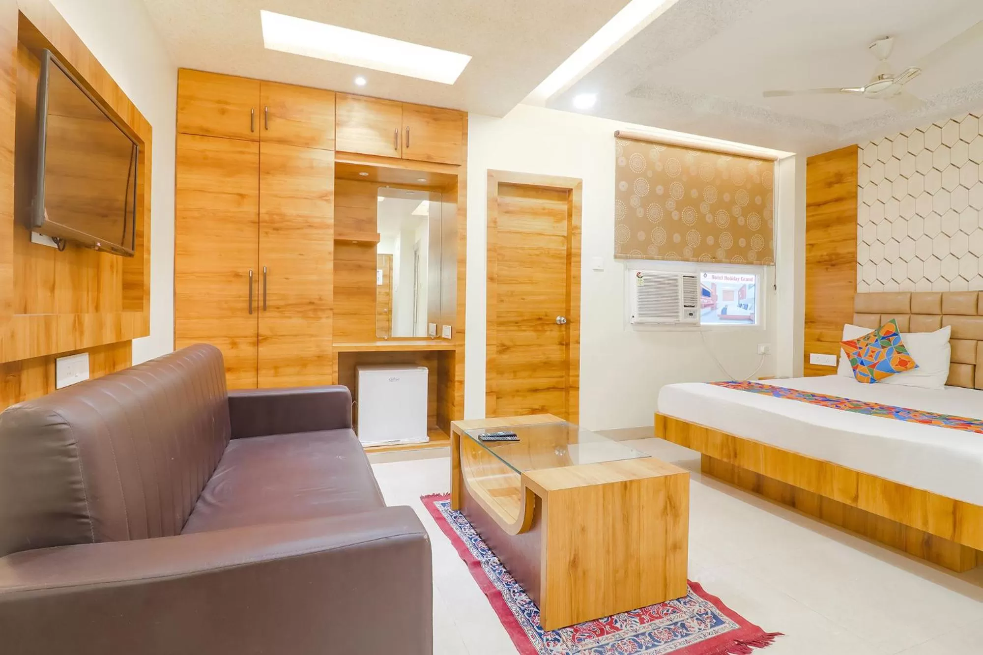 Bed in FabHotel Holiday Grand