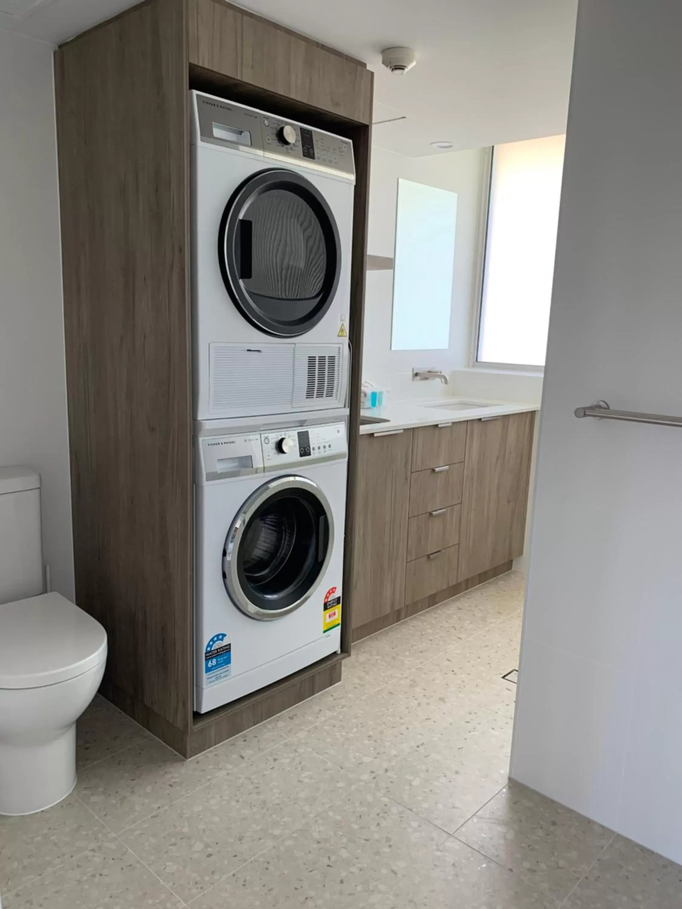 washing machine, Bathroom in Pacific Regis Beachfront Holiday Apartments