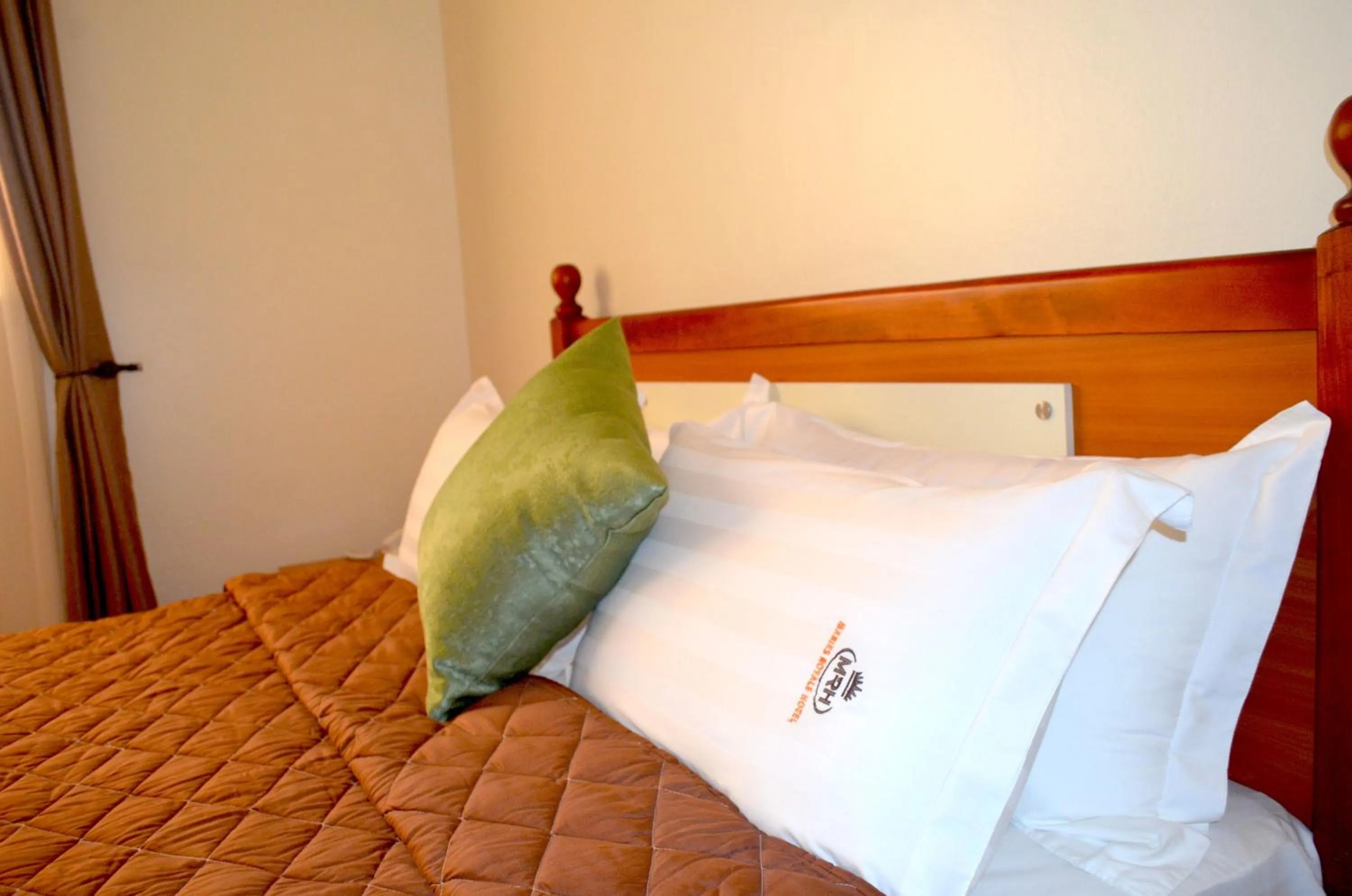 Bed in Marie's Royale Hotel