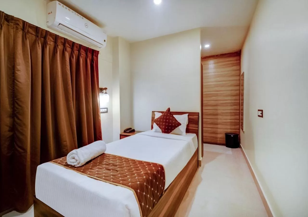 Bed in Hotel Sai Rain Tree