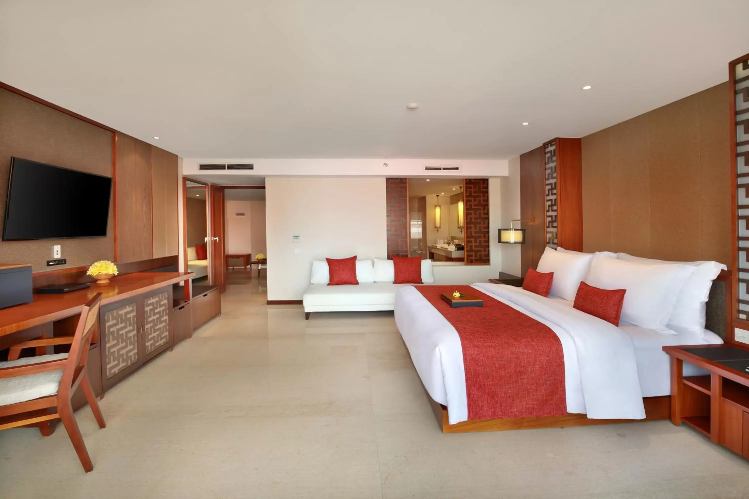 Bed, TV/Entertainment Center in The Bandha Hotel & Suites