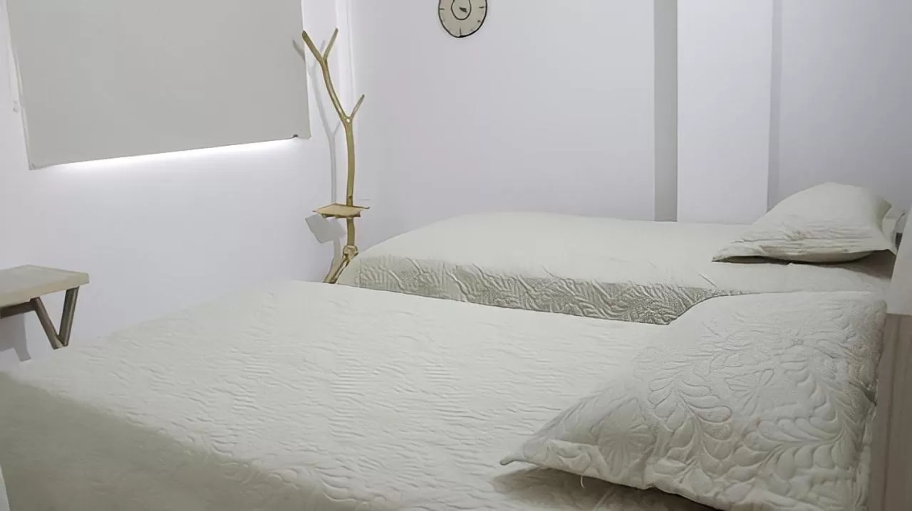 Bed in Hotel Iraka Zenu