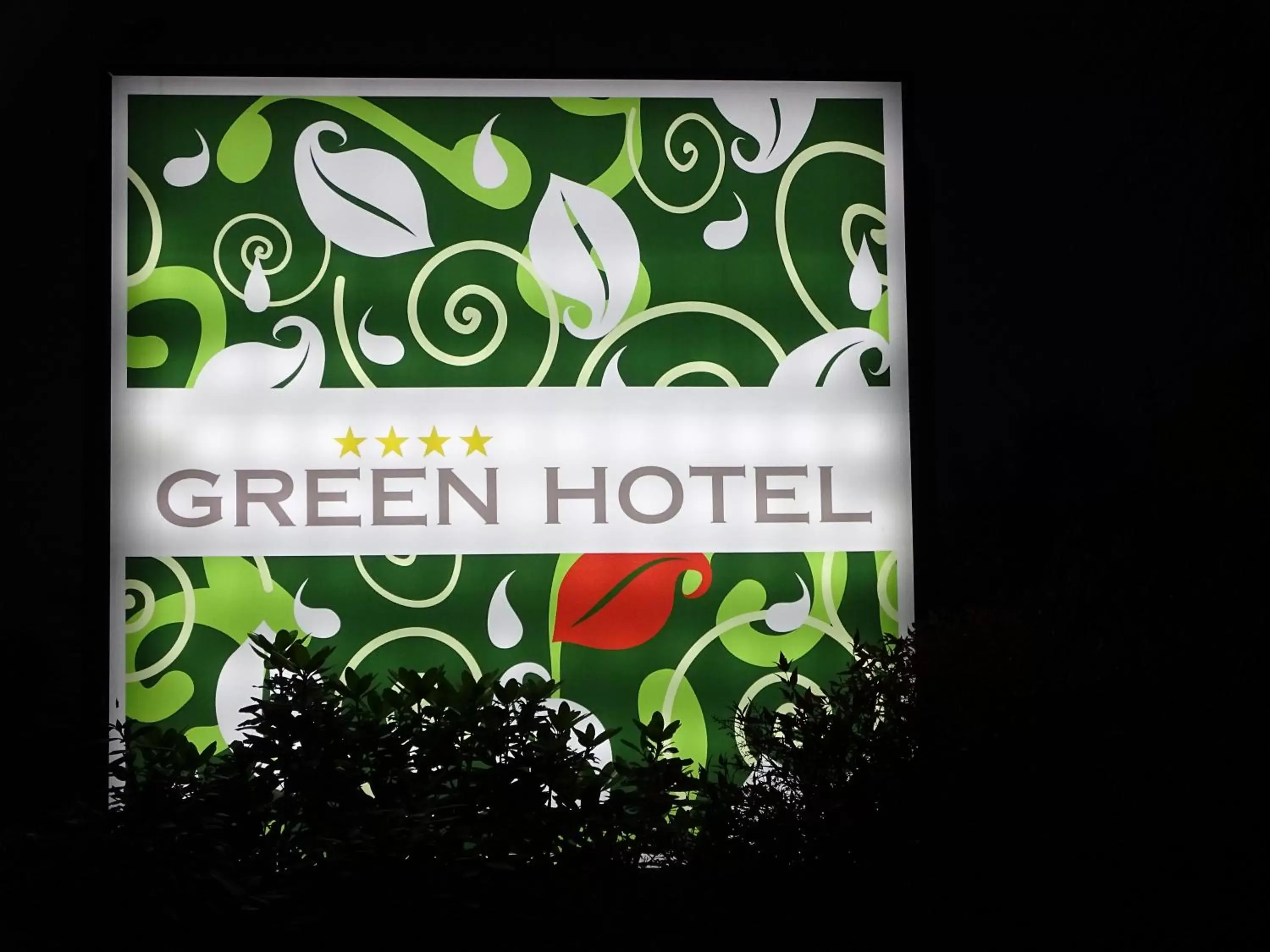 Property logo or sign in Green Hotel Motel
