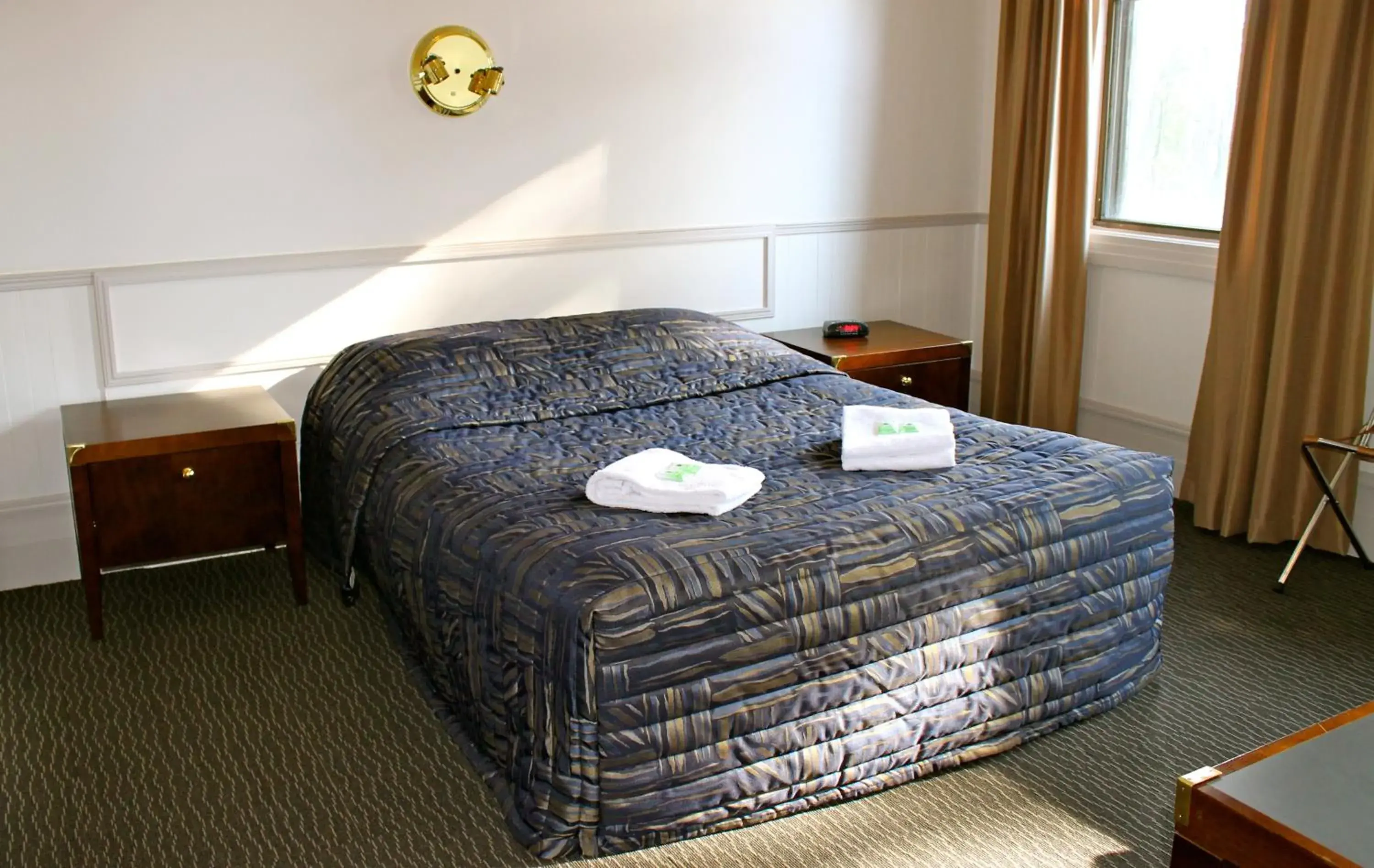 Bed in Royal Exhibition Hotel