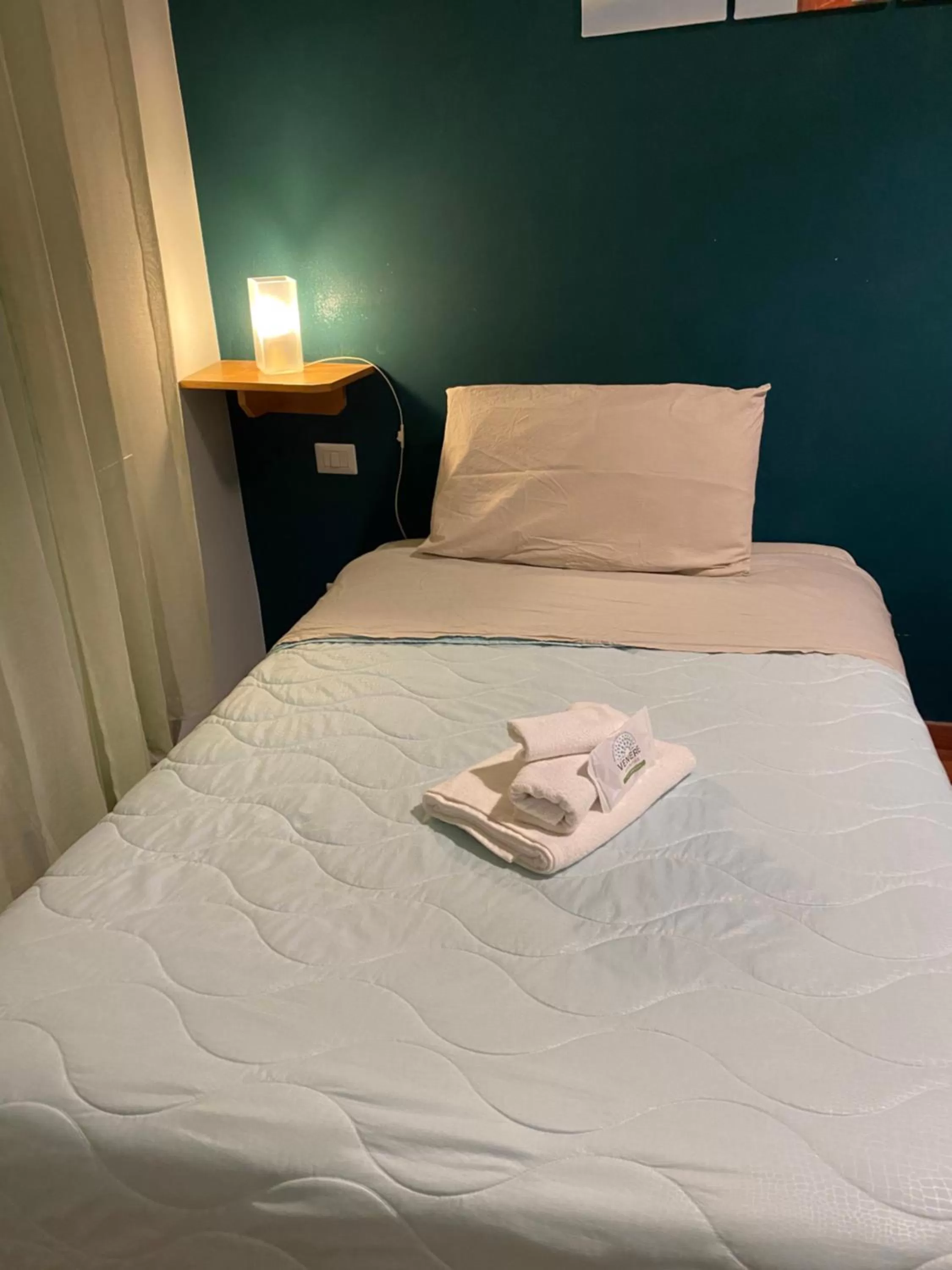 Bed in AmareRomaRooms