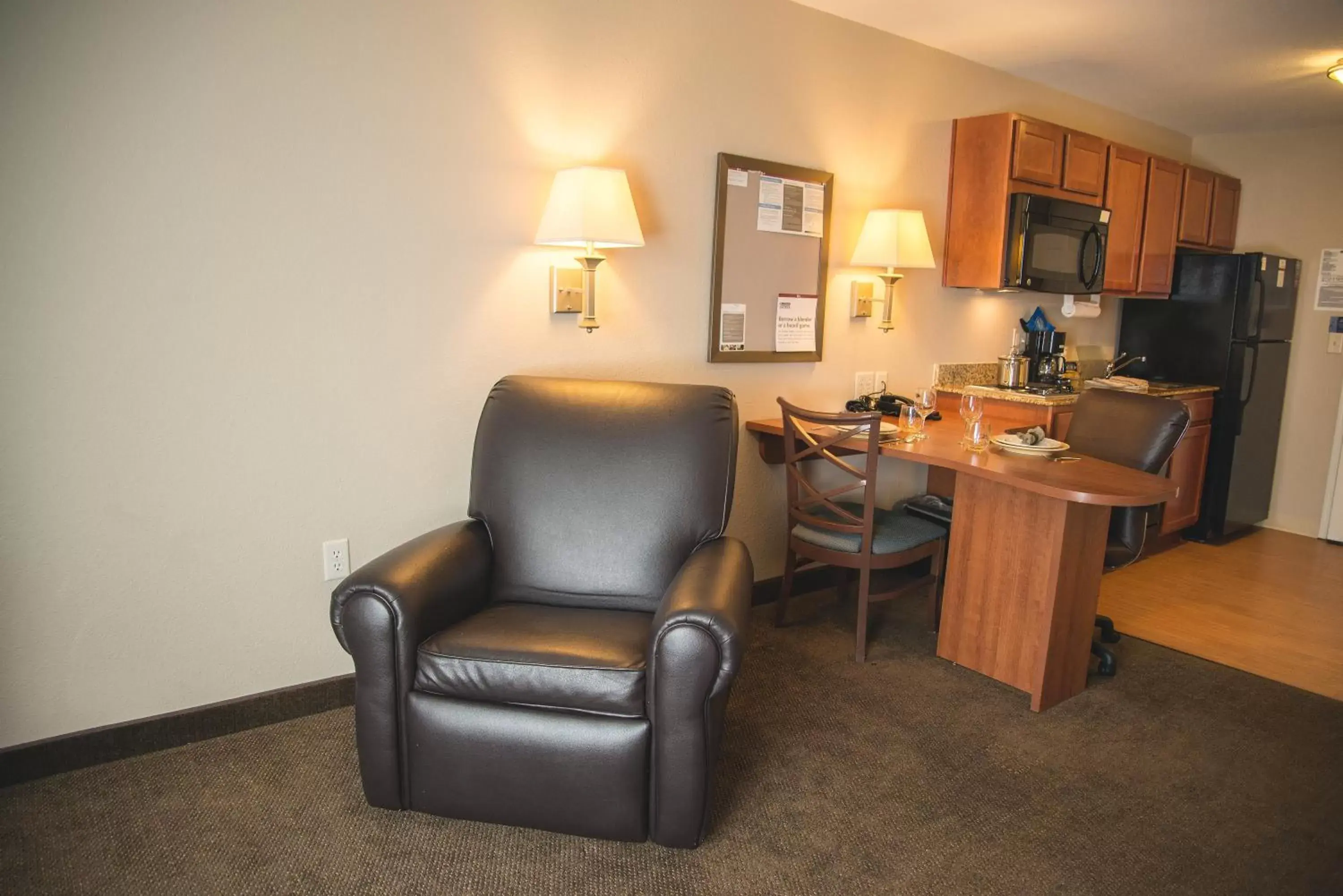 Bedroom, Seating Area in Candlewood Suites Loveland, an IHG Hotel