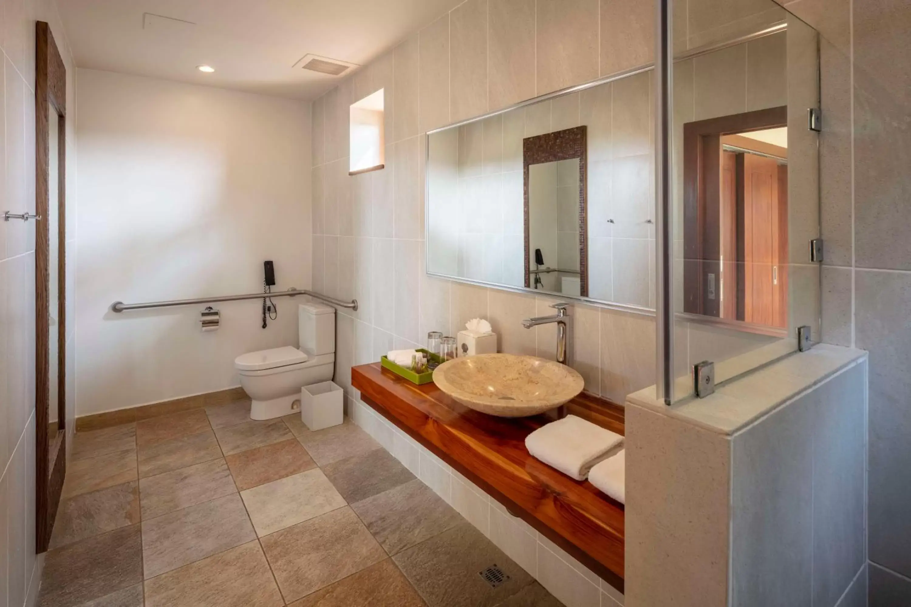 Bathroom in Indura Beach & Golf Resort Curio Collection By Hilton