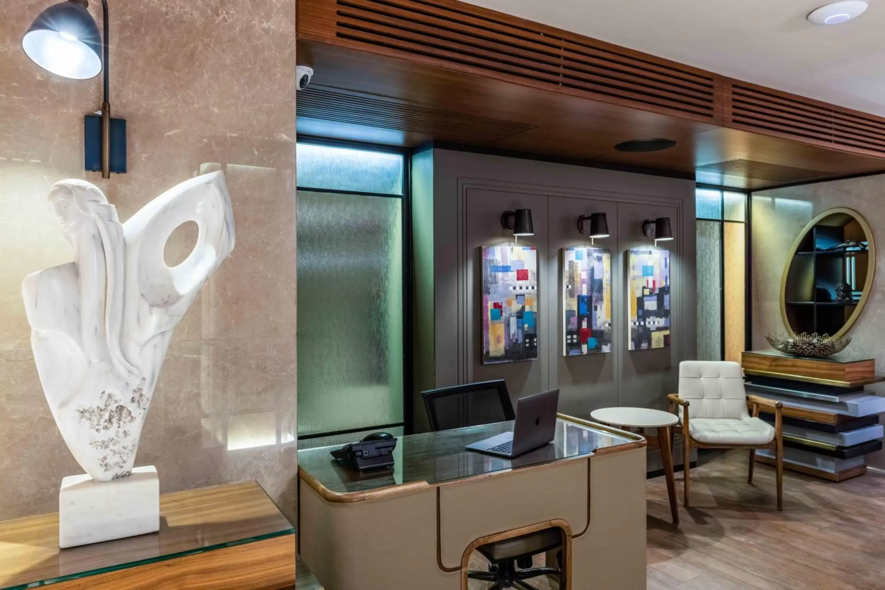 Lobby or reception, TV/Entertainment Center in Tzl Suites Hotel