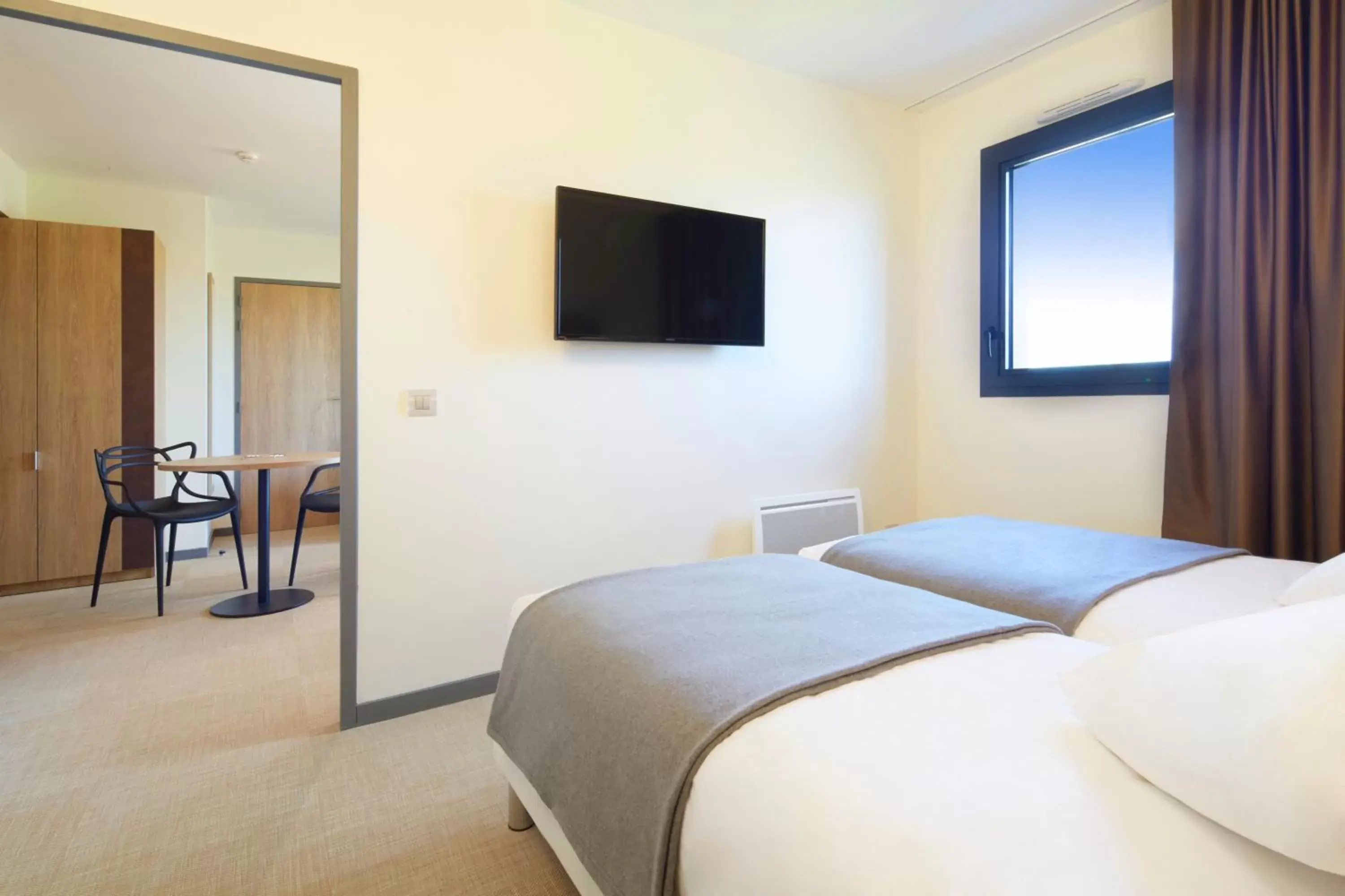 Bed in Kyriad Prestige Residence Cabourg-Dives-sur-Mer