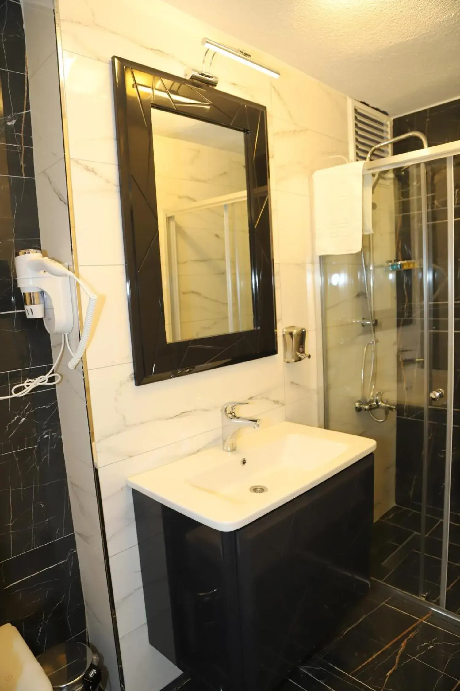 Bathroom in Grand Kavi Hotel