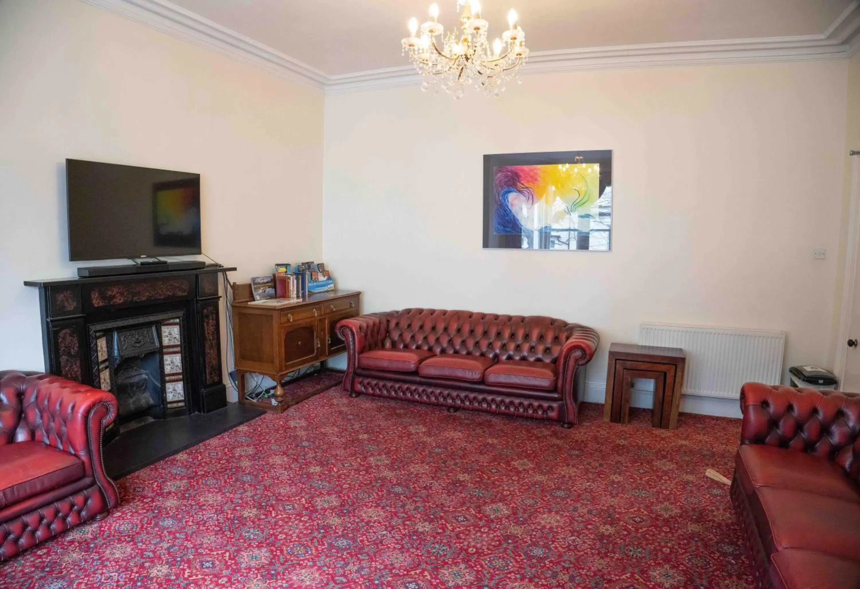 Communal lounge/ TV room, Seating Area in Llandudno Hostel