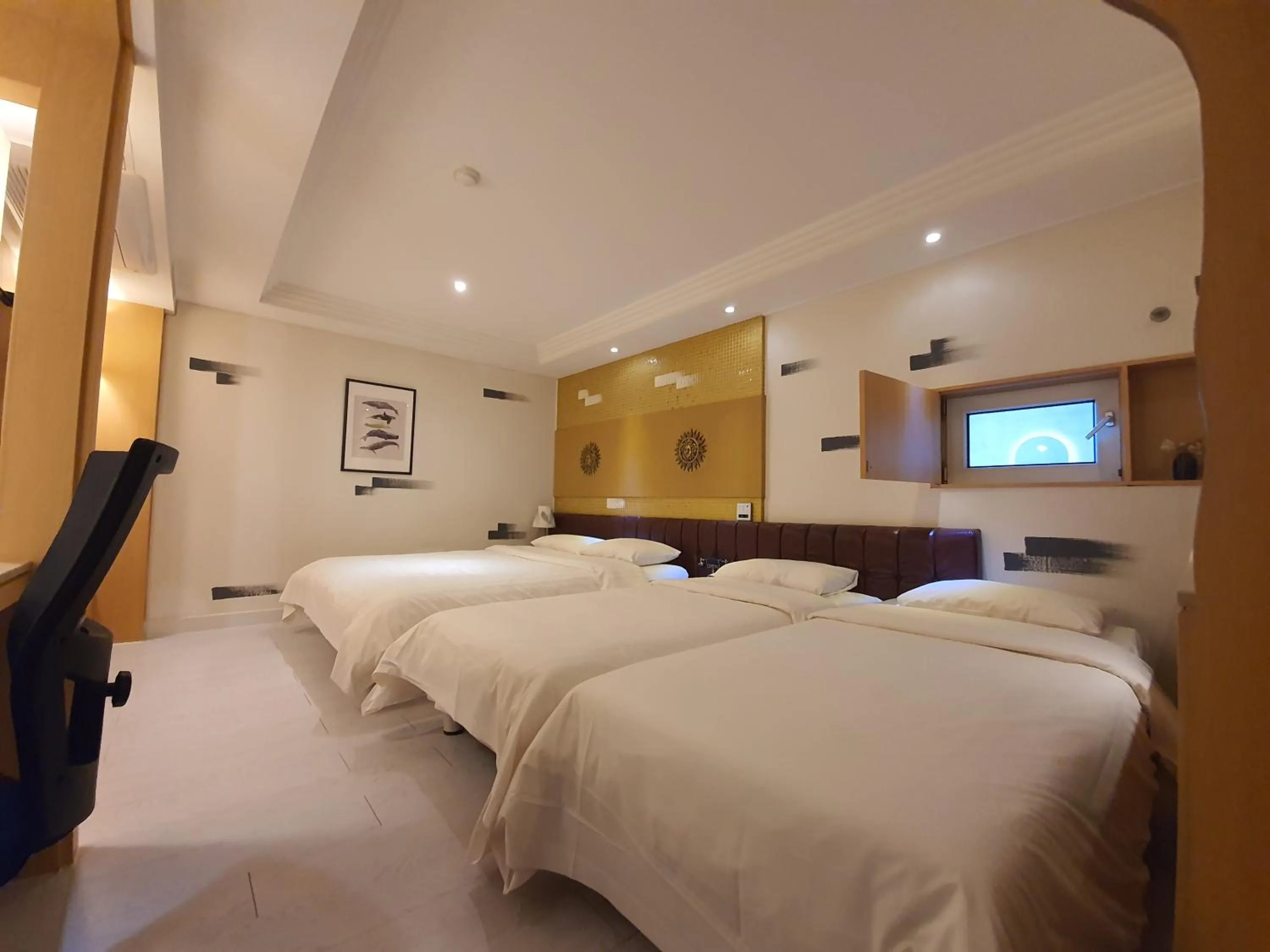 Bed in Friendly DH Naissance Hotel by Mindrum Group