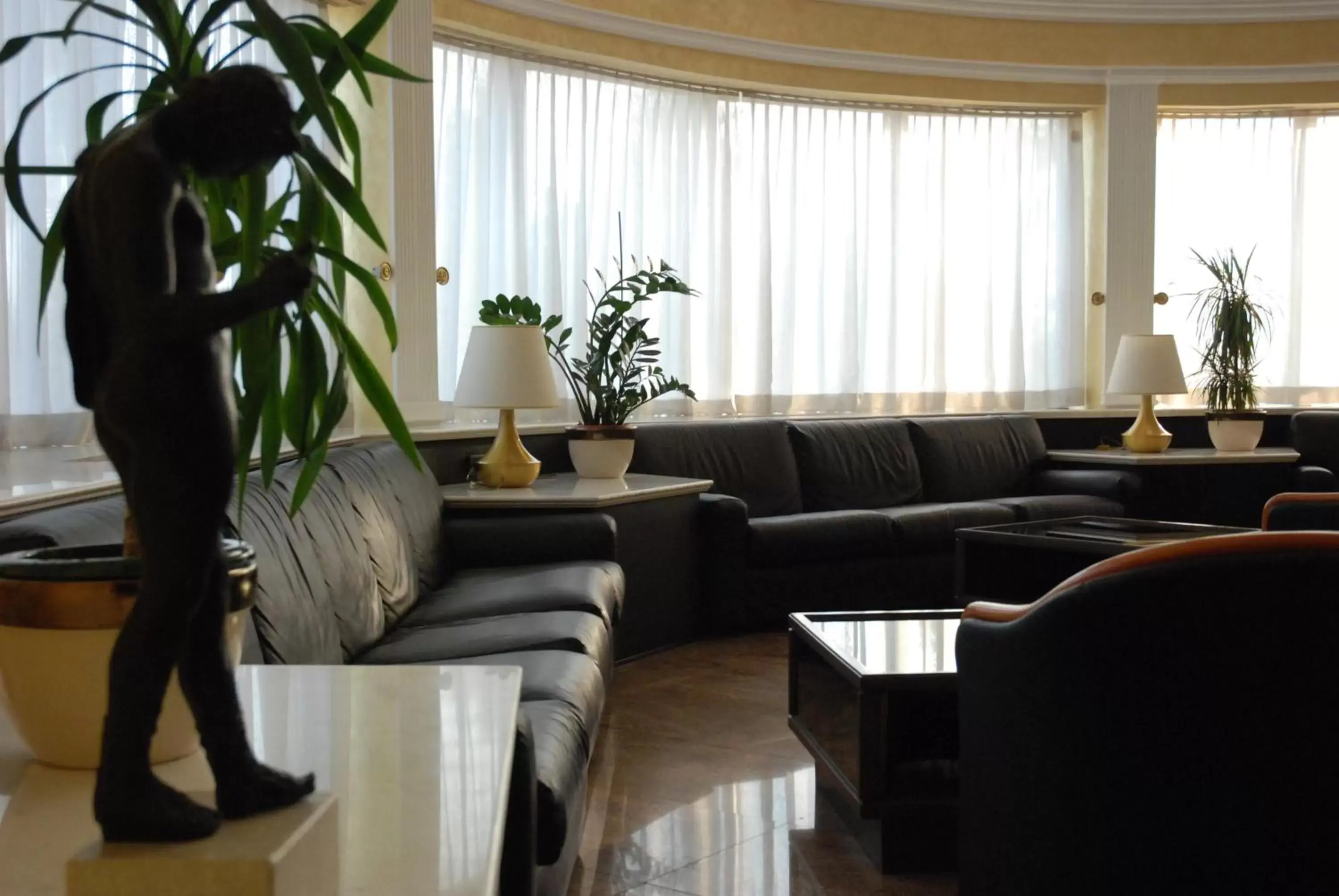 Communal lounge/ TV room, Seating Area in Forum Palace Hotel