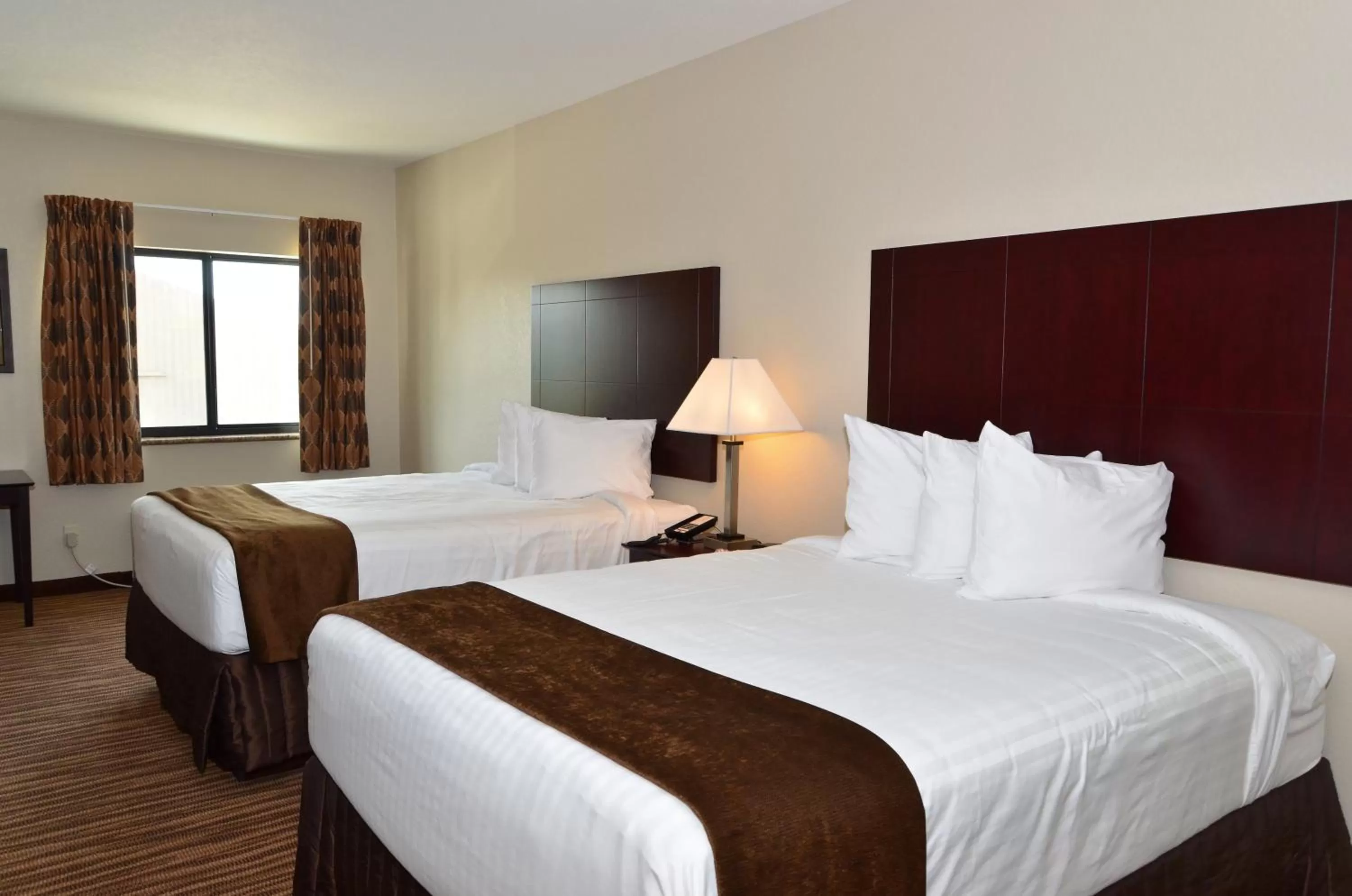 Bed in Cobblestone Inn & Suites - Clarion