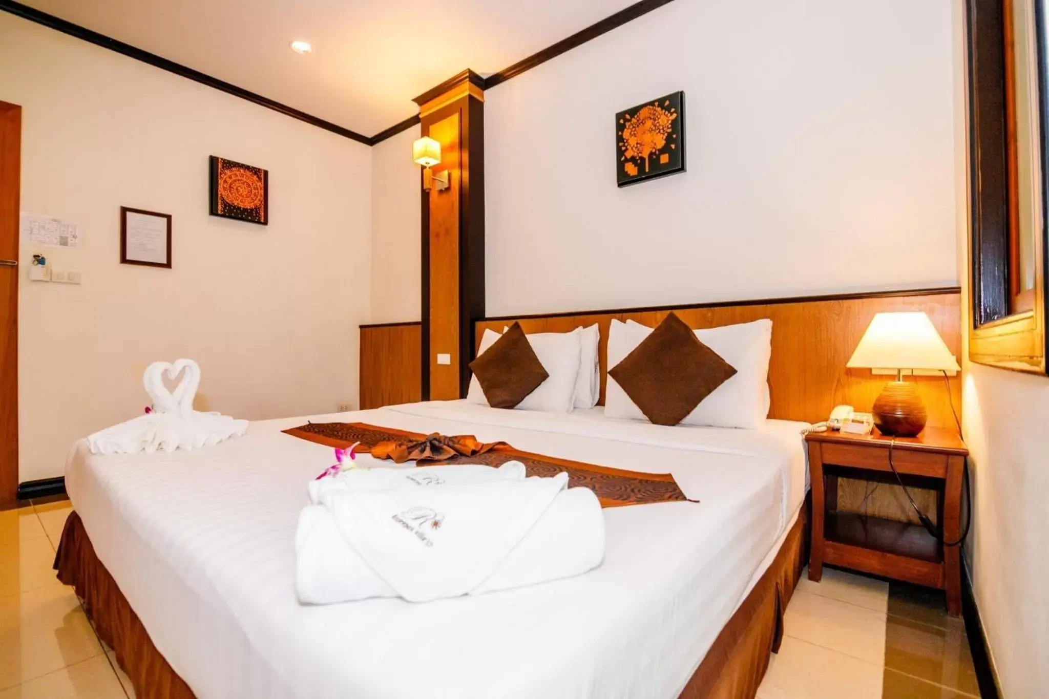 Bed in Rapeepan Ville Hotel